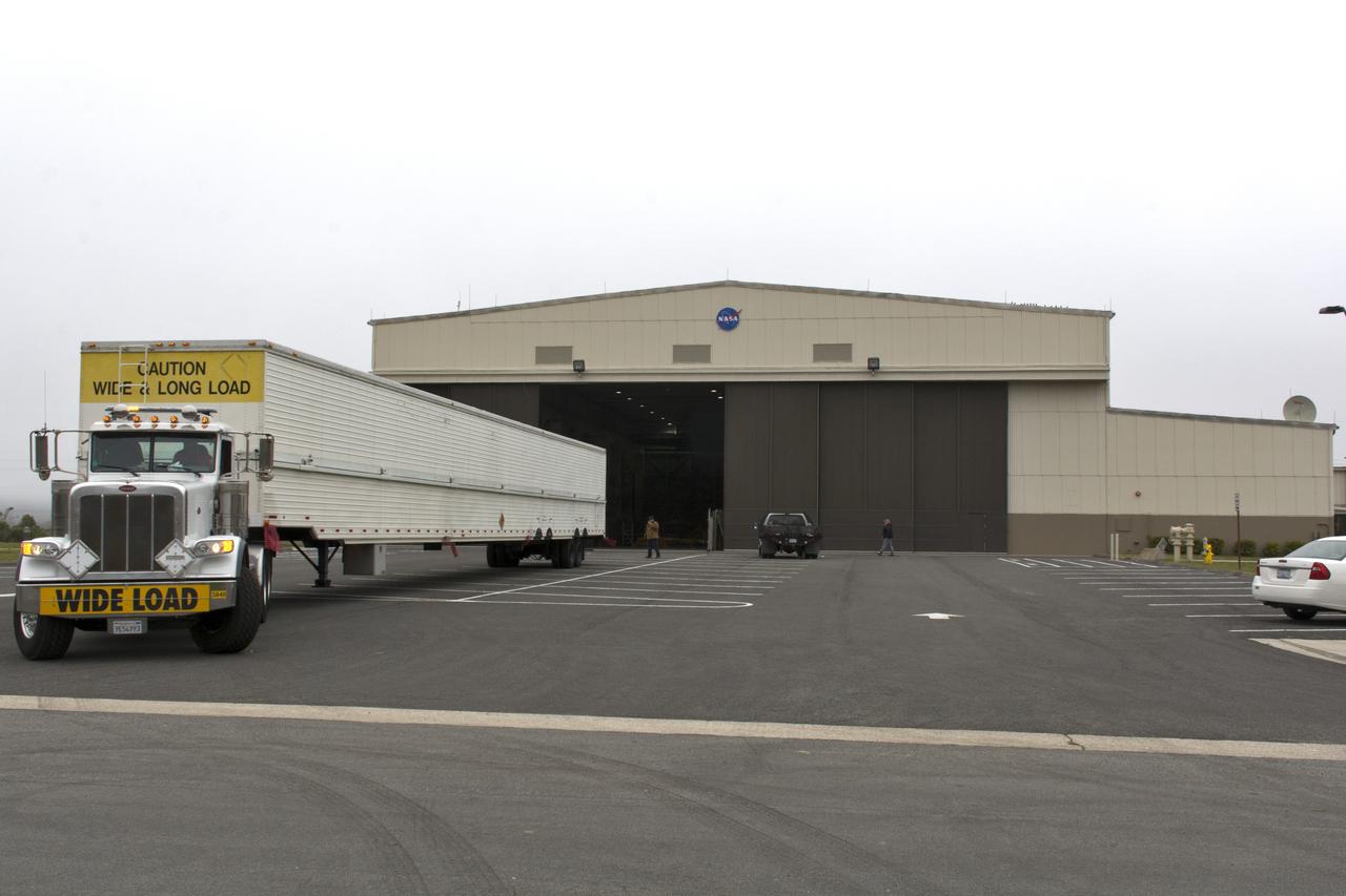 A United Launch Alliance Delta II booster arrives at NASA's Building 836, the Spacecraft Labs Telemetry Station at Vandenberg Air Force Base in California. It will be offloaded and begin preliminary checkouts and preflight processing for launch of the agency's Ice, Cloud and land Elevation Satellite-2, or ICESat-2. Liftoff from Space Launch Complex-2 at Vandenberg is scheduled for Sept. 12, 2018, and will be the last for the venerable Delta II rocket. Once in orbit, the satellite is designed to measure the height of a changing Earth, one laser pulse at a time, 10,000 laser pulses a second. The satellite will carry a single instrument, the Advanced Topographic Laser Altimeter System. ICESat-2 will help scientists investigate why, and how much, Earth's frozen and icy areas are changing. These area make up Earth's the cryosphere.