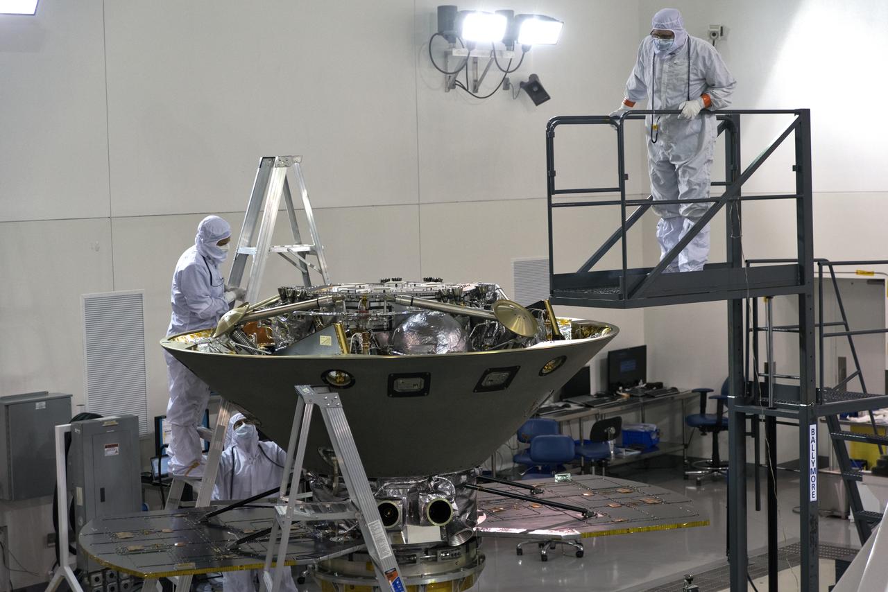 In the Astrotech facility at Vandenberg Air Force Base in California, technicians and engineers inspect NASA's Interior Exploration using Seismic Investigations, Geodesy and Heat Transport, or InSight, spacecraft after it was placed on a spin table during preflight processing. InSight will be the first mission to look deep beneath the Martian surface. It will study the planet's interior by measuring its heat output and listen for marsquakes. The spacecraft will use the seismic waves generated by marsquakes to develop a map of the planet’s deep interior. The resulting insight into Mars’ formation will provide a better understanding of how other rocky planets, including Earth, were created. InSight is scheduled for liftoff May 5, 2018.