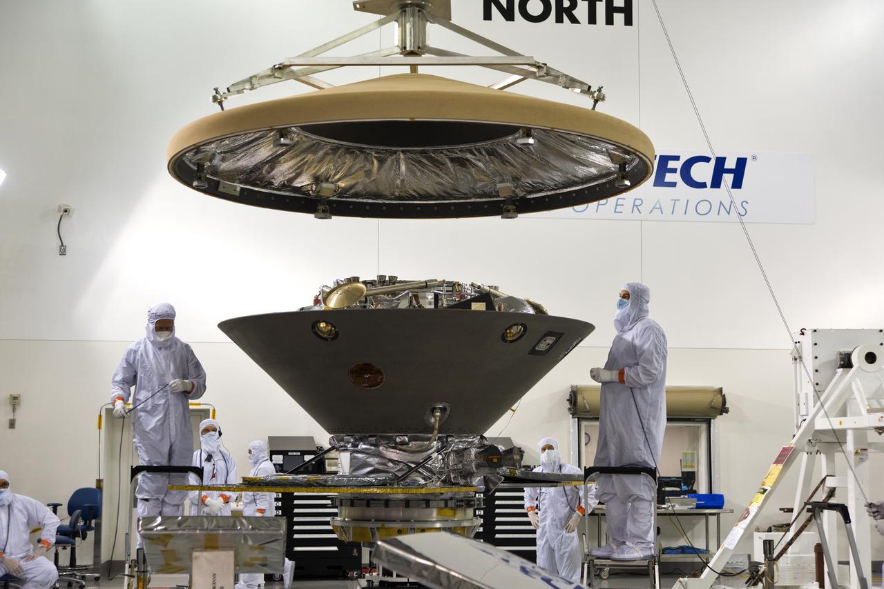 In the Astrotech facility at Vandenberg Air Force Base in California, the heatshield is placed on NASA's Interior Exploration using Seismic Investigations, Geodesy and Heat Transport, or InSight, Mars lander. InSight will be the first mission to look deep beneath the Martian surface. It will study the planet's interior by measuring its heat output and listen for marsquakes. The spacecraft will use the seismic waves generated by marsquakes to develop a map of the planet’s deep interior. The resulting insight into Mars’ formation will provide a better understanding of how other rocky planets, including Earth, were created. InSight is scheduled for liftoff May 5, 2018.