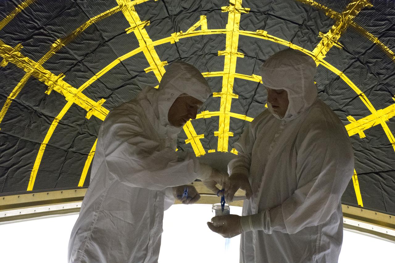 On Friday, April 6, 2018, in NASA’s Building 8337 at Vandenberg Air Force Base in California, technicians and engineers clean and take samples from the payload fairing the will protect NASA's Ice, Cloud and land Elevation Satellite-2, or ICESat-2, satellite during launch. Liftoff atop a United Launch Alliance Delta II rocket is scheduled for Sept. 12, 2018, from Space Launch Complex-2 at Vandenberg. It will be the last for the venerable Delta II rocket. ICESat-2, which is being built and tested by Orbital ATK in Gilbert, Arizona, will carry a single instrument called the Advanced Topographic Laser Altimeter System, or ATLAS. The ATLAS instrument is being built and tested at NASA’s Goddard Space Flight Center in Greenbelt Maryland. Once in orbit, the satellite is designed to measure the height of a changing Earth, one laser pulse at a time, 10,000 laser pulses a second. ICESat-2 will help scientists investigate why, and how much, Earth’s frozen and icy areas, called the cryosphere, are changing.