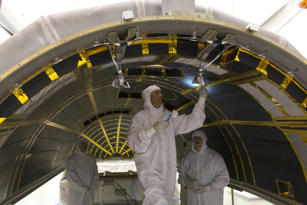 On Friday, April 6, 2018, in NASA’s Building 8337 at Vandenberg Air Force Base in California, technicians and engineers clean and take samples from the payload fairing the will protect NASA's Ice, Cloud and land Elevation Satellite-2, or ICESat-2, satellite during launch. Liftoff atop a United Launch Alliance Delta II rocket is scheduled for Sept. 12, 2018, from Space Launch Complex-2 at Vandenberg. It will be the last for the venerable Delta II rocket. ICESat-2, which is being built and tested by Orbital ATK in Gilbert, Arizona, will carry a single instrument called the Advanced Topographic Laser Altimeter System, or ATLAS. The ATLAS instrument is being built and tested at NASA’s Goddard Space Flight Center in Greenbelt Maryland. Once in orbit, the satellite is designed to measure the height of a changing Earth, one laser pulse at a time, 10,000 laser pulses a second. ICESat-2 will help scientists investigate why, and how much, Earth’s frozen and icy areas, called the cryosphere, are changing.