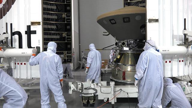 In the Astrotech facility at Vandenberg Air Force Base in California, technicians and engineers encapsulate NASA's Interior Exploration using Seismic Investigations, Geodesy and Heat Transport, or InSight, Mars lander in its payload fairing. InSight will be the first mission to look deep beneath the Martian surface. It will study the planet's interior by measuring its heat output and listen for marsquakes. The spacecraft will use the seismic waves generated by marsquakes to develop a map of the planet’s deep interior. The resulting insight into Mars’ formation will provide a better understanding of how other rocky planets, including Earth, were created. InSight is scheduled for liftoff May 5, 2018.