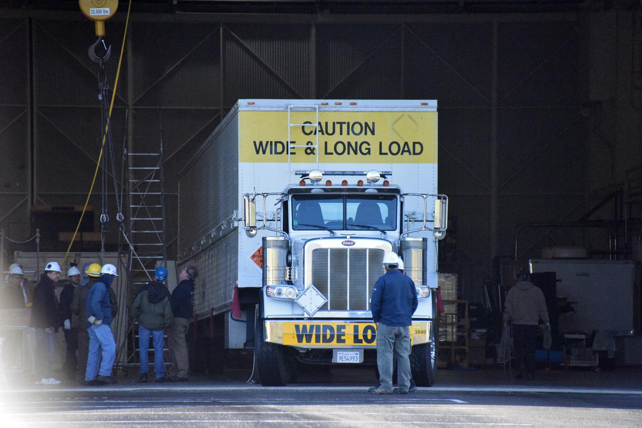 A United Launch Alliance Delta II booster arrives at NASA's Building 836, the Spacecraft Labs Telemetry Station at Vandenberg Air Force Base in California. It will be offloaded and begin preliminary checkouts and preflight processing for launch of the agency's Ice, Cloud and land Elevation Satellite-2, or ICESat-2. Liftoff from Space Launch Complex-2 at Vandenberg is scheduled for Sept. 12, 2018, and will be the last for the venerable Delta II rocket. Once in orbit, the satellite is designed to measure the height of a changing Earth, one laser pulse at a time, 10,000 laser pulses a second. The satellite will carry a single instrument, the Advanced Topographic Laser Altimeter System. ICESat-2 will help scientists investigate why, and how much, Earth's frozen and icy areas are changing. These area make up Earth's the cryosphere.