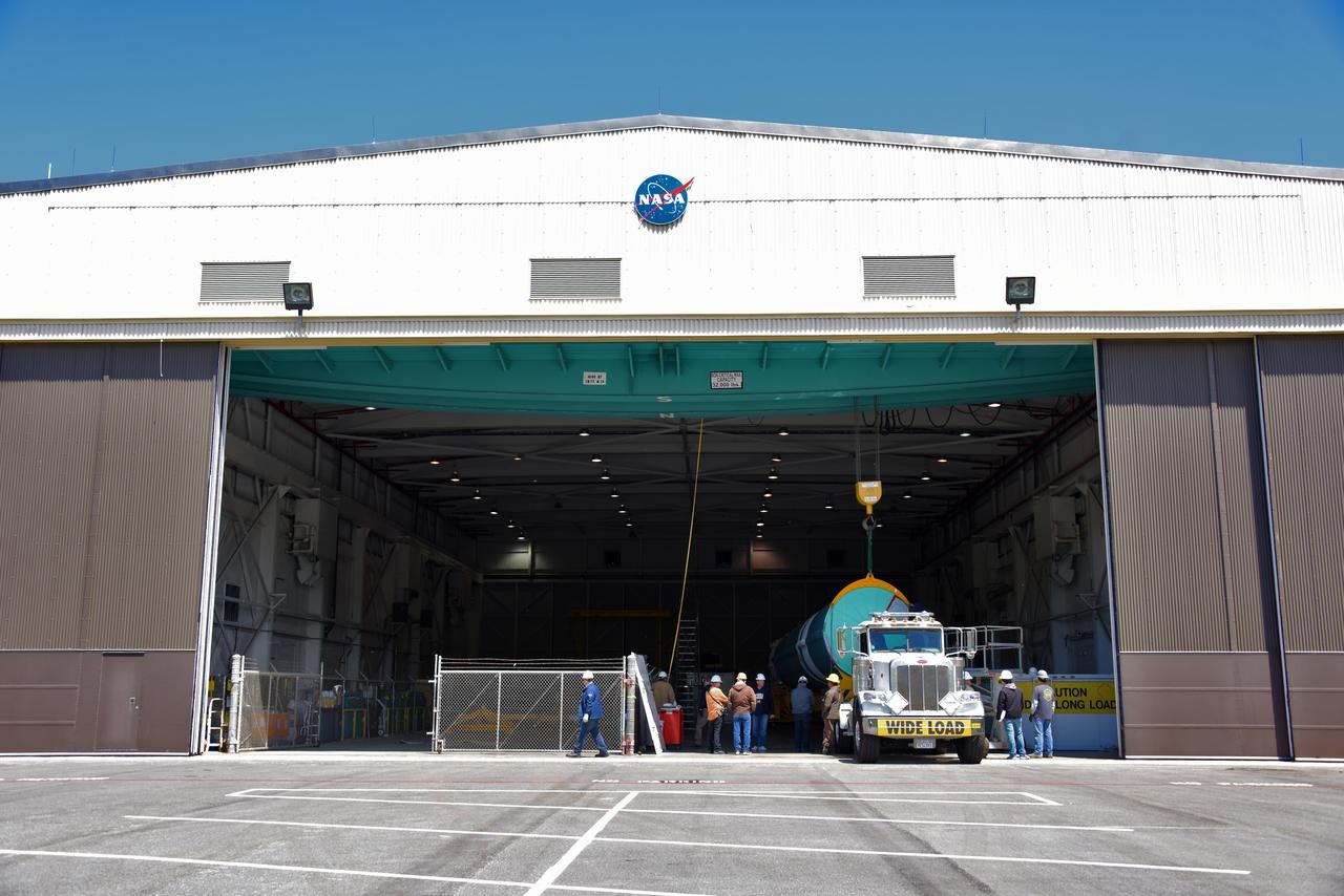At NASA's Building 836, the Spacecraft Labs Telemetry Station at Vandenberg Air Force Base in California, a United Launch Alliance Delta II booster has been removed from its shipping container. Preliminary checkouts and preflight processing will begin leading to launch of the agency's Ice, Cloud and land Elevation Satellite-2, or ICESat-2. Liftoff from Space Launch Complex-2 at Vandenberg is scheduled for Sept. 12, 2018, and will be the last for the venerable Delta II rocket. Once in orbit, the satellite is designed to measure the height of a changing Earth, one laser pulse at a time, 10,000 laser pulses a second. The satellite will carry a single instrument, the Advanced Topographic Laser Altimeter System. ICESat-2 will help scientists investigate why, and how much, Earth's frozen and icy areas are changing. These area make up Earth's the cryosphere.