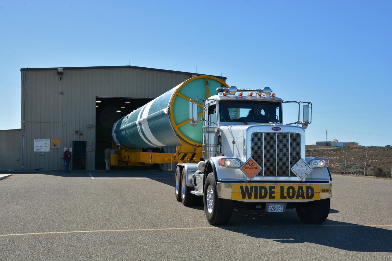 At NASA's Building 836, the Spacecraft Labs Telemetry Station at Vandenberg Air Force Base in California, on Tuesday, April 17, 2018, a United Launch Alliance (ULA) Delta II booster is transported to Space Launch Complex-2 where it will launch NASA's Ice, Cloud and land Elevation Satellite-2, or ICESat-2, satellite. This will be the last flight for the venerable Delta II rocket. ICESat-2, which is being built and tested by Orbital ATK in Gilbert, Arizona, will carry a single instrument called the Advanced Topographic Laser Altimeter System, or ATLAS. The ATLAS instrument is being built and tested at NASA’s Goddard Space Flight Center in Greenbelt Maryland. Once in orbit, the satellite is designed to measure the height of a changing Earth, one laser pulse at a time, 10,000 laser pulses a second. ICESat-2 will help scientists investigate why, and how much, Earth’s frozen and icy areas, called the cryosphere, are changing.