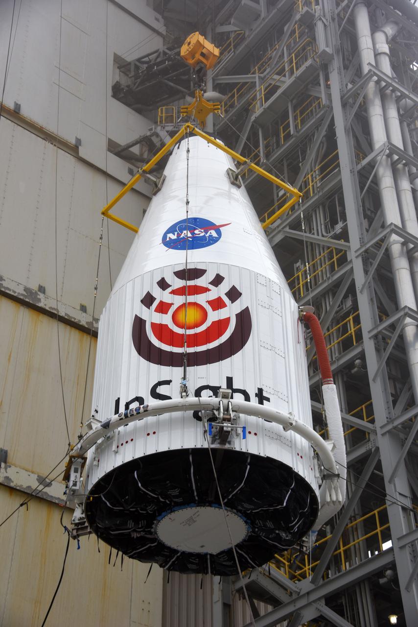 At Space Launch Complex 3 at Vandenberg Air Force Base in California, a crane is used to lift NASA's Interior Exploration using Seismic Investigations, Geodesy and Heat Transport, or InSight, Mars lander for mating atop a United Launch Alliance Atlas V rocket. InSight will be the first mission to look deep beneath the Martian surface. It will study the planet's interior by measuring its heat output and listen for marsquakes. The spacecraft will use the seismic waves generated by marsquakes to develop a map of the planet’s deep interior. The resulting insight into Mars’ formation will provide a better understanding of how other rocky planets, including Earth, were created. InSight is scheduled for liftoff May 5, 2018.