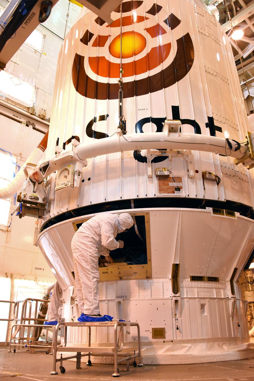 At Space Launch Complex 3 at Vandenberg Air Force Base in California, technicians and engineers position NASA's Interior Exploration using Seismic Investigations, Geodesy and Heat Transport, or InSight, Mars lander atop a United Launch Alliance Atlas V rocket. InSight will be the first mission to look deep beneath the Martian surface. It will study the planet's interior by measuring its heat output and listen for marsquakes. The spacecraft will use the seismic waves generated by marsquakes to develop a map of the planet’s deep interior. The resulting insight into Mars’ formation will provide a better understanding of how other rocky planets, including Earth, were created. InSight is scheduled for liftoff May 5, 2018.