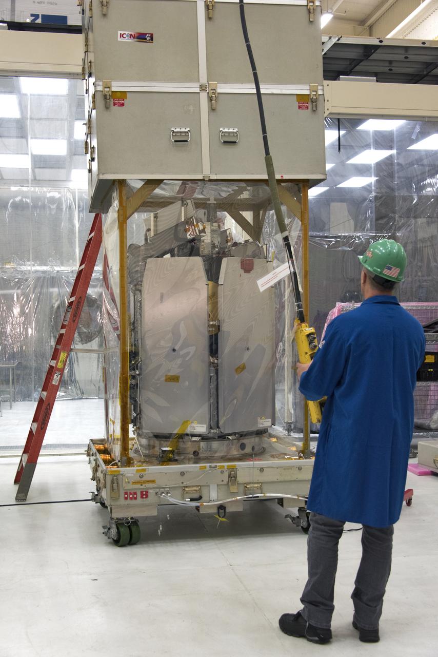 A technician operates a crane that lifts the shipping container up from NASA's Ionospheric Connection Explorer (ICON) on May 1, 2018, inside Building 1555 at Vandenberg Air Force Base in California. The explorer will launch on June 15, 2018, from Kwajalein Atoll in the Marshall Islands (June 14 in the continental United States) on Orbital ATK's Pegasus XL rocket, which is attached to the company's L-1011 Stargazer aircraft. ICON will study the frontier of space - the dynamic zone high in Earth's atmosphere where terrestrial weather from below meets space weather above. The explorer will help determine the physics of Earth's space environment and pave the way for mitigating its effects on our technology, communications systems and society.