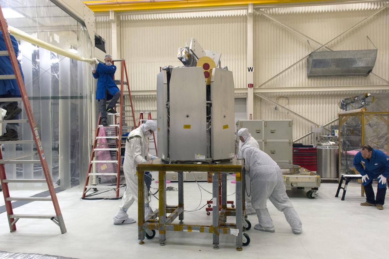 Technicians prepare NASA's Ionospheric Connection Explorer (ICON) for its move to a clean room on May 4, 2018, inside Building 1555 at Vandenberg Air Force Base in California. The explorer will launch on June 15, 2018, from Kwajalein Atoll in the Marshall Islands (June 14 in the continental United States) on Orbital ATK's Pegasus XL rocket, which is attached to the company's L-1011 Stargazer aircraft. ICON will study the frontier of space - the dynamic zone high in Earth's atmosphere where terrestrial weather from below meets space weather above. The explorer will help determine the physics of Earth's space environment and pave the way for mitigating its effects on our technology, communications systems and society.