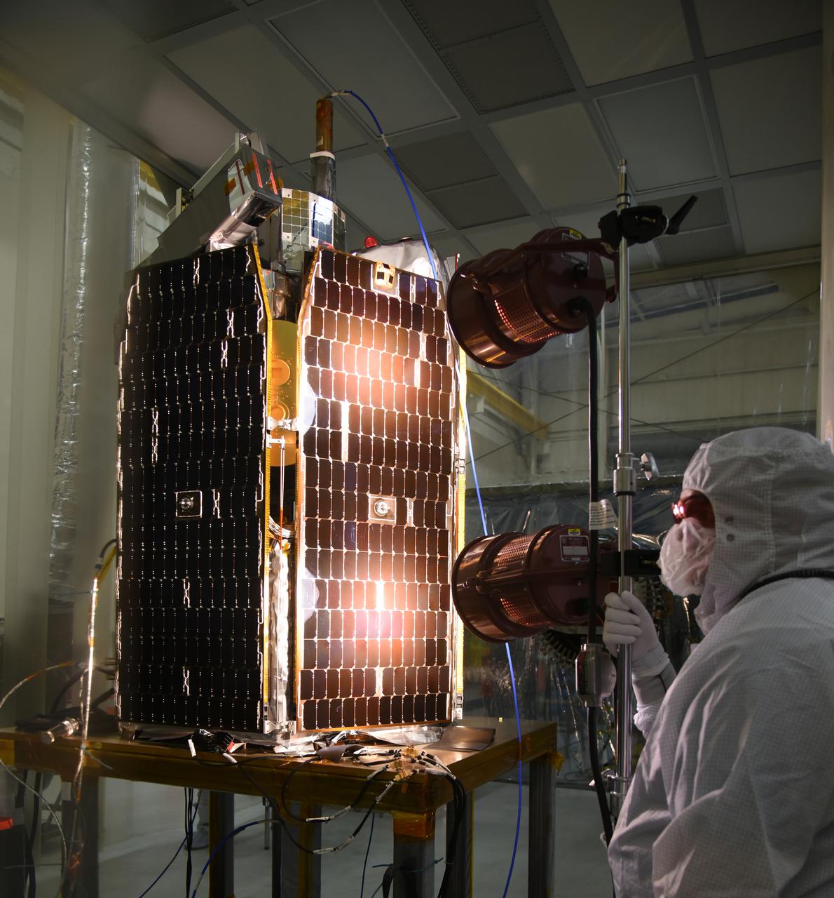 A solar array illumination test is performed on NASA's Ionospheric Connection Explorer (ICON) in a clean room on May 4, 2018, inside Building 1555 at Vandenberg Air Force Base in California. The test checks for any imperfections and confirms that the solar arrays are functioning properly. The explorer will launch on June 15, 2018, from Kwajalein Atoll in the Marshall Islands (June 14 in the continental United States) on Orbital ATK's Pegasus XL rocket, which is attached to the company's L-1011 Stargazer aircraft. ICON will study the frontier of space - the dynamic zone high in Earth's atmosphere where terrestrial weather from below meets space weather above. The explorer will help determine the physics of Earth's space environment and pave the way for mitigating its effects on our technology, communications systems and society.