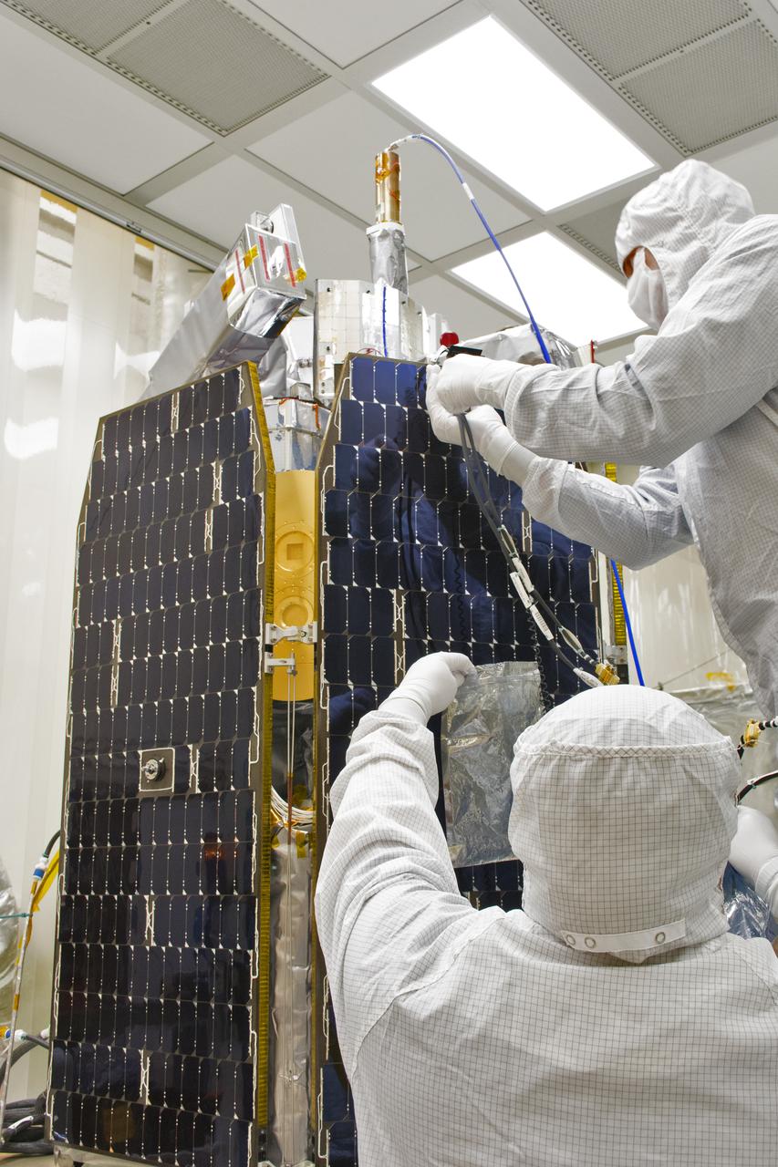 Technicians prepare NASA's Ionospheric Connection Explorer (ICON) for a solar array illumination test in a clean room inside Building 1555 at Vandenberg Air Force Base in California on May 4, 2018. The test checks for any imperfections and confirms that the solar arrays are functioning properly. The explorer will launch on June 15, 2018, from Kwajalein Atoll in the Marshall Islands (June 14 in the continental United States) on Orbital ATK's Pegasus XL rocket, which is attached to the company's L-1011 Stargazer aircraft. ICON will study the frontier of space - the dynamic zone high in Earth's atmosphere where terrestrial weather from below meets space weather above. The explorer will help determine the physics of Earth's space environment and pave the way for mitigating its effects on our technology, communications systems and society.