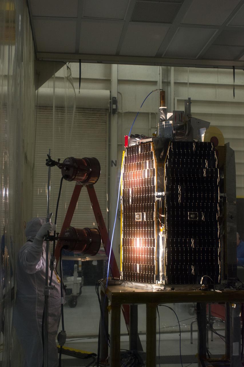 A solar array illumination test is performed on NASA's Ionospheric Connection Explorer (ICON) in a clean room inside Building 1555 at Vandenberg Air Force Base in California on May 4, 2018. The test checks for any imperfections and confirms that the solar arrays are functioning properly. The explorer will launch on June 15, 2018, from Kwajalein Atoll in the Marshall Islands (June 14 in the continental United States) on Orbital ATK's Pegasus XL rocket, which is attached to the company's L-1011 Stargazer aircraft. ICON will study the frontier of space - the dynamic zone high in Earth's atmosphere where terrestrial weather from below meets space weather above. The explorer will help determine the physics of Earth's space environment and pave the way for mitigating its effects on our technology, communications systems and society.