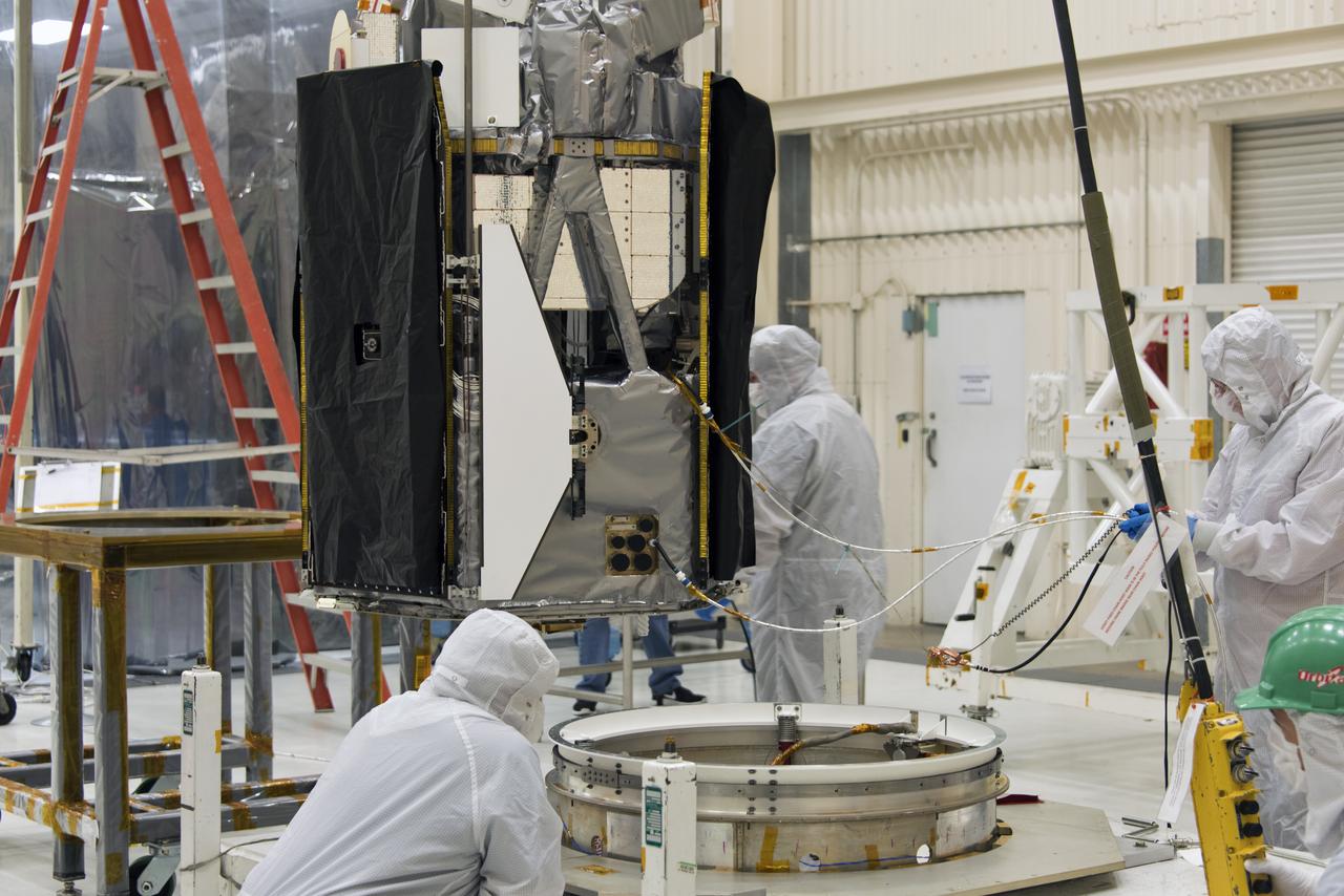 Technicians prepare NASA's Ionospheric Connection Explorer (ICON) to be attached to the spacecraft separation system May 9, 2018, in a clean room inside Building 1555 at Vandenberg Air Force Base in California. The explorer will launch on June 15, 2018, from Kwajalein Atoll in the Marshall Islands (June 14 in the continental United States) on Orbital ATK's Pegasus XL rocket, which is attached to the company's L-1011 Stargazer aircraft. ICON will study the frontier of space - the dynamic zone high in Earth's atmosphere where terrestrial weather from below meets space weather above. The explorer will help determine the physics of Earth's space environment and pave the way for mitigating its effects on our technology, communications systems and society.