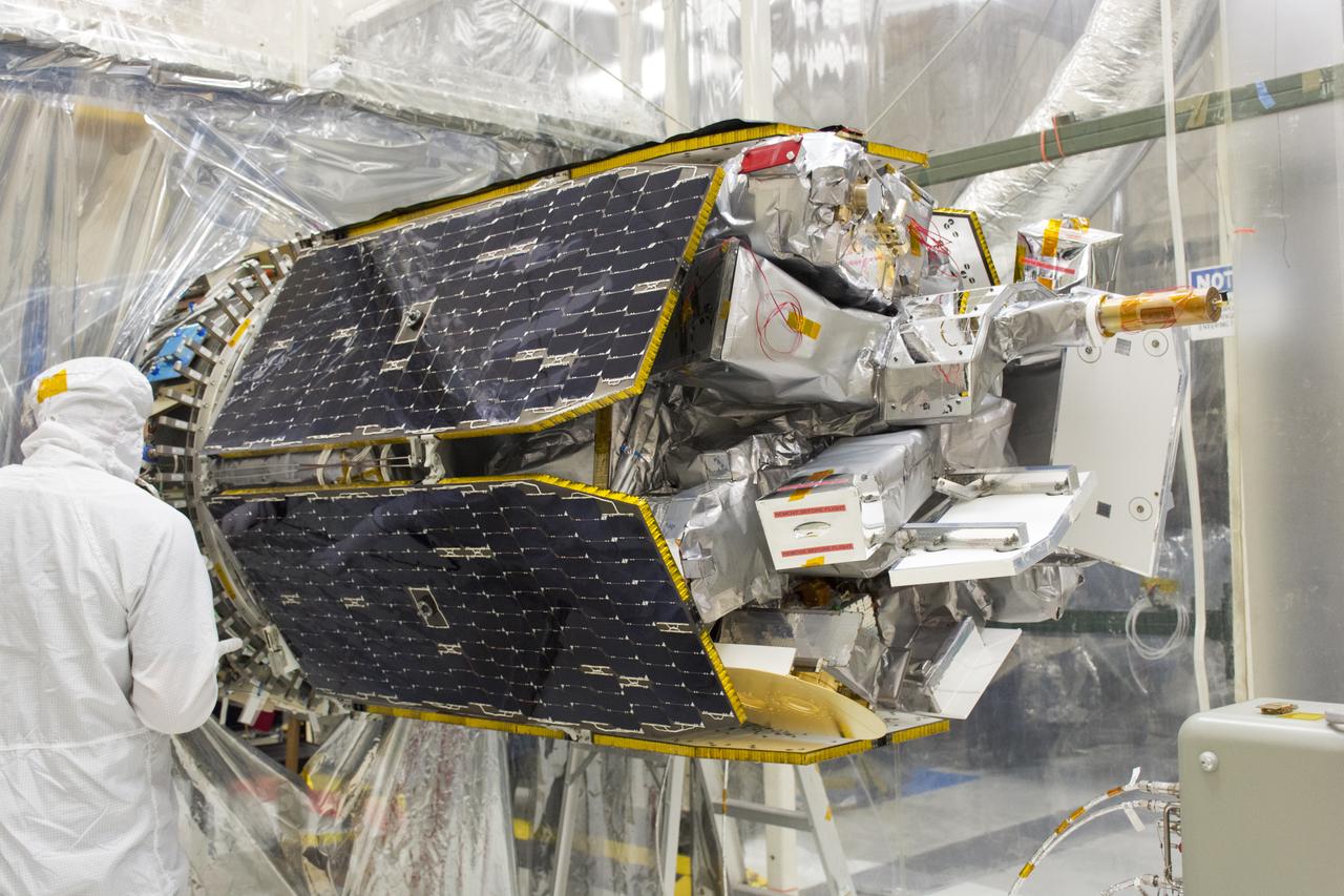 A technician assists with connections as NASA's Ionospheric Connection Explorer (ICON) is attached to the Orbital ATK Pegasus XL rocket May 14, 2018, inside a clean room in Building 1555 at Vandenberg Air Force Base in California. The explorer will launch on June 15, 2018, from Kwajalein Atoll in the Marshall Islands (June 14 in the continental United States) on the Pegasus XL rocket, which is attached to the company's L-1011 Stargazer aircraft. ICON will study the frontier of space - the dynamic zone high in Earth's atmosphere where terrestrial weather from below meets space weather above. The explorer will help determine the physics of Earth's space environment and pave the way for mitigating its effects on our technology, communications systems and society.