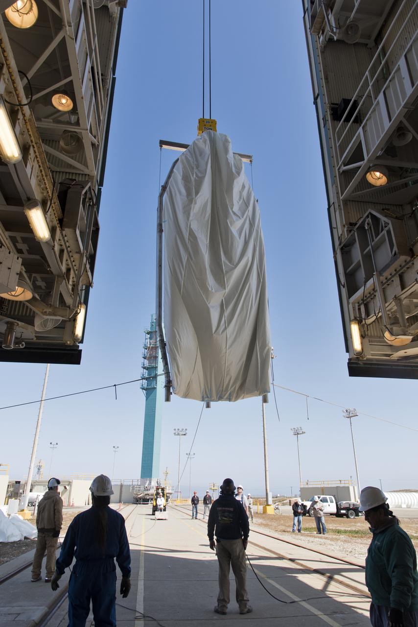 The second half of the United Launch Alliance (ULA) Delta II rocket payload fairing is lifted up into the Vertical Integration Facility at Space Launch Complex 2 at Vandenberg Air Force Base in California, on June 4, 2018. NASA's Ice, Cloud and land Elevation Satellite-2 (ICESat-2) will launch later this year on the final Delta II rocket. ICESat-2 will measure the height of a changing Earth, one laser pulse at a time, 10,000 laser pulses a second. The satellite will carry a single instrument, the Advanced Topographic Laser Altimeter System. ICESat-2 will help scientists investigate why, and how much our planet's frozen and icy areas, called the cryosphere, is changing in a warming climate.