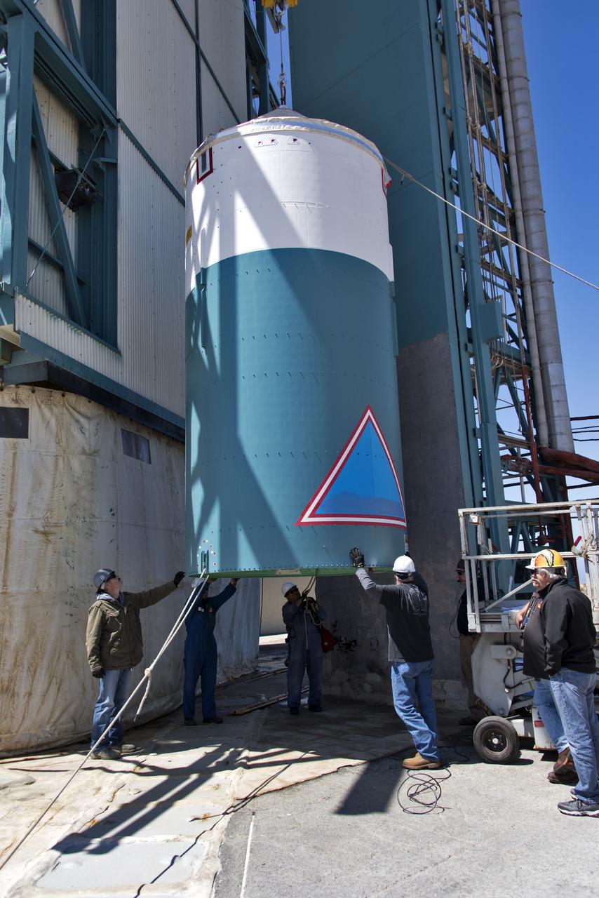 The United Launch Alliance Delta II interstage is lifted up at the Vertical Integration Facility at Space Launch Complex 2 on June 12, 2018, at Vandenberg Air Force Base in California. The interstage will be moved in and mated to the top of the booster, or first stage of the rocket. NASA's Ice, Cloud and land Elevation Satellite-2 (ICESat-2) will launch on the final Delta II rocket. ICESat-2 will measure the height of a changing Earth, one laser pulse at a time, 10,000 laser pulses a second. The satellite will carry a single instrument, the Advanced Topographic Laser Altimeter System. ICESat-2 will help scientists investigate why, and how much our planet's frozen and icy areas, called the cryosphere, is changing in a warming climate.