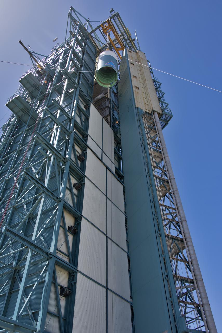 The United Launch Alliance Delta II interstage is lifted high up at the Vertical Integration Facility at Space Launch Complex 2 on June 12, 2018, at Vandenberg Air Force Base in California. The interstage will be moved in and mated to the top of the booster, or first stage of the rocket. NASA's Ice, Cloud and land Elevation Satellite-2 (ICESat-2) will launch on the final Delta II rocket. ICESat-2 will measure the height of a changing Earth, one laser pulse at a time, 10,000 laser pulses a second. The satellite will carry a single instrument, the Advanced Topographic Laser Altimeter System. ICESat-2 will help scientists investigate why, and how much our planet's frozen and icy areas, called the cryosphere, is changing in a warming climate.