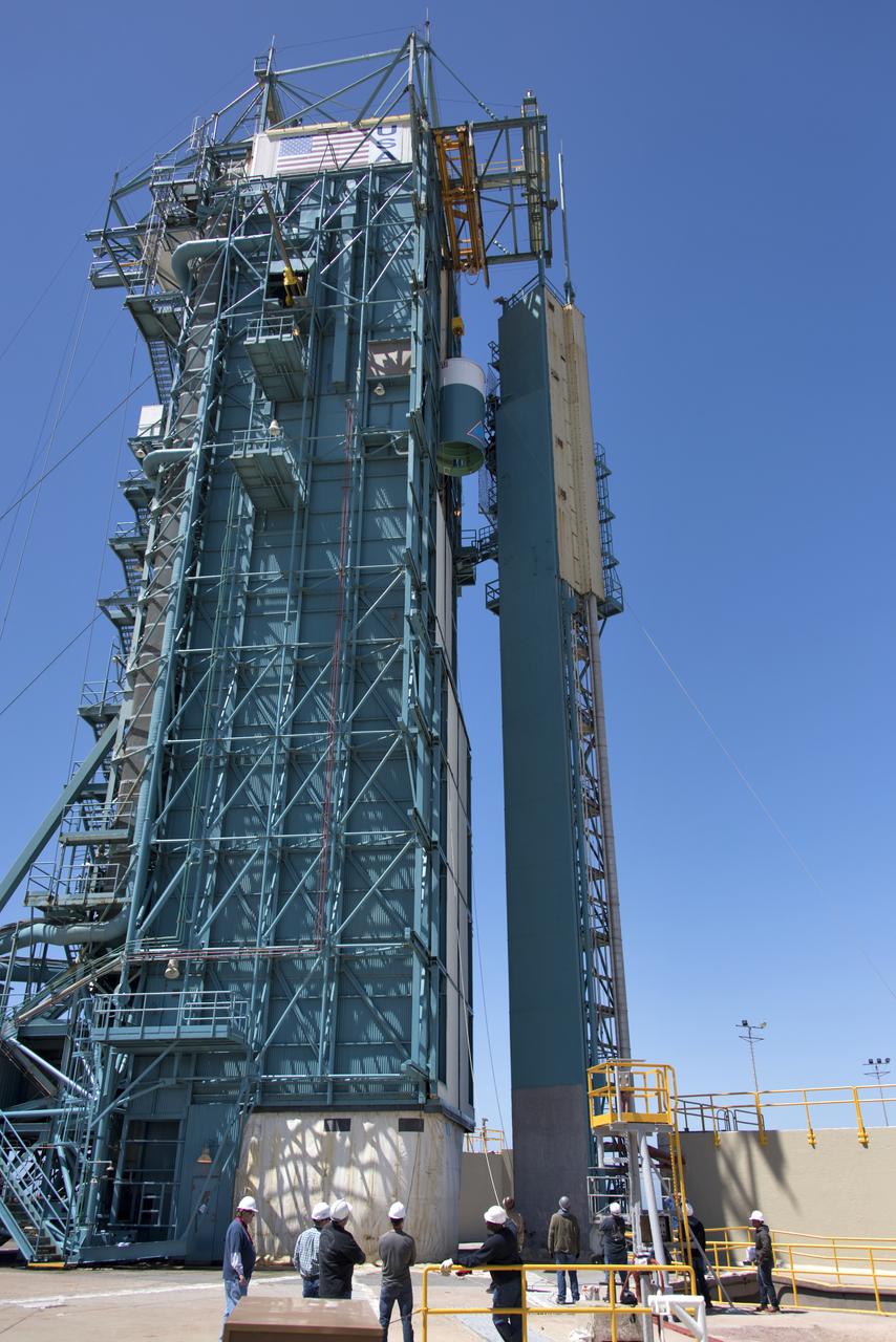 The United Launch Alliance Delta II interstage is lifted high up at the Vertical Integration Facility at Space Launch Complex 2 on June 12, 2018, at Vandenberg Air Force Base in California. The interstage will be moved in and mated to the top of the booster, or first stage of the rocket. NASA's Ice, Cloud and land Elevation Satellite-2 (ICESat-2) will launch on the final Delta II rocket. ICESat-2 will measure the height of a changing Earth, one laser pulse at a time, 10,000 laser pulses a second. The satellite will carry a single instrument, the Advanced Topographic Laser Altimeter System. ICESat-2 will help scientists investigate why, and how much our planet's frozen and icy areas, called the cryosphere, is changing in a warming climate.