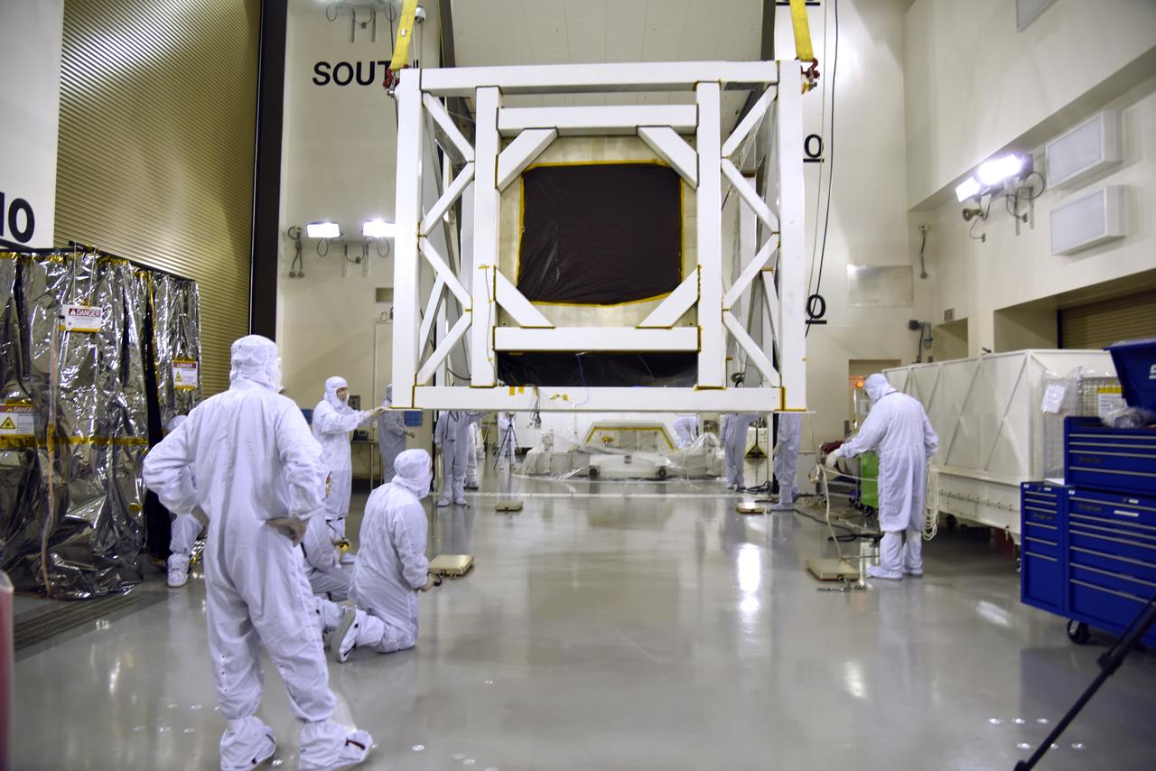 Technicians assist as a crane moves NASA's Ice, Cloud and land Elevation Satellite-2 (ICESat-2) into the high bay of the Astrotech processing facility on June 13, 2018, at Vandenberg Air Force Base in California. ICESat-2 was shipped from the Northrop Grumman facility in Gilbert, Arizona, where it was built and tested. The satellite is scheduled to launch from Space Launch Complex-2 at Vandenberg on the final United Launch Alliance Delta II rocket. ICESat-2 will measure the height of a changing Earth, one laser pulse at a time, 10,000 laser pulses a second. The satellite will carry the Advanced Topographic Laser Altimeter System. ICESat-2 will help scientists investigate why, and how much our planet's frozen and icy areas, called the cryosphere, is changing in a warming climate.