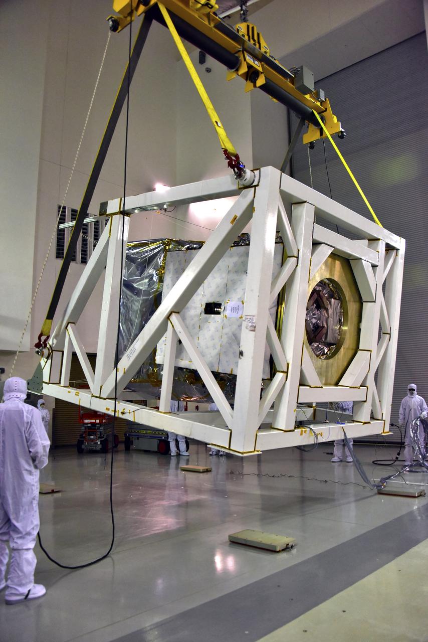 NASA's Ice, Cloud and land Elevation Satellite-2 (ICESat-2) is lifted in its fixture inside the high bay of the Astrotech Space Operations facility on June 14, 2018, at Vandenberg Air Force Base in California. ICESat-2 was shipped from the Northrop Grumman facility in Gilbert, Arizona, where it was built and tested. The satellite is scheduled to launch from Space Launch Complex-2 at Vandenberg on the final United Launch Alliance Delta II rocket. ICESat-2 will measure the height of a changing Earth, one laser pulse at a time, 10,000 laser pulses a second. The satellite will carry the Advanced Topographic Laser Altimeter System. ICESat-2 will help scientists investigate why, and how much our planet's frozen and icy areas, called the cryosphere, is changing in a warming climate.