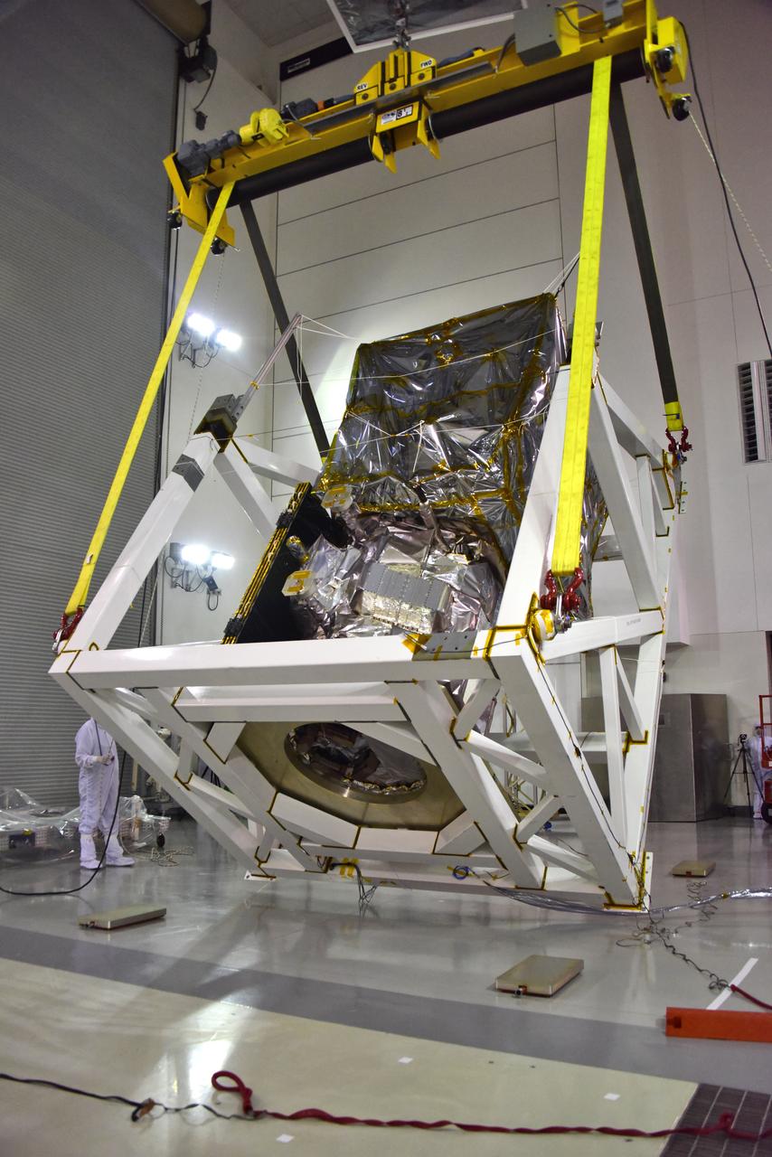 A crane is used to rotate NASA's Ice, Cloud and land Elevation Satellite-2 (ICESat-2) in its fixture inside the high bay of the Astrotech Space Operations facility on June 14, 2018, at Vandenberg Air Force Base in California. ICESat-2 was shipped from the Northrop Grumman facility in Gilbert, Arizona, where it was built and tested. The satellite is scheduled to launch from Space Launch Complex-2 at Vandenberg on the final United Launch Alliance Delta II rocket. ICESat-2 will measure the height of a changing Earth, one laser pulse at a time, 10,000 laser pulses a second. The satellite will carry the Advanced Topographic Laser Altimeter System. ICESat-2 will help scientists investigate why, and how much our planet's frozen and icy areas, called the cryosphere, is changing in a warming climate. 