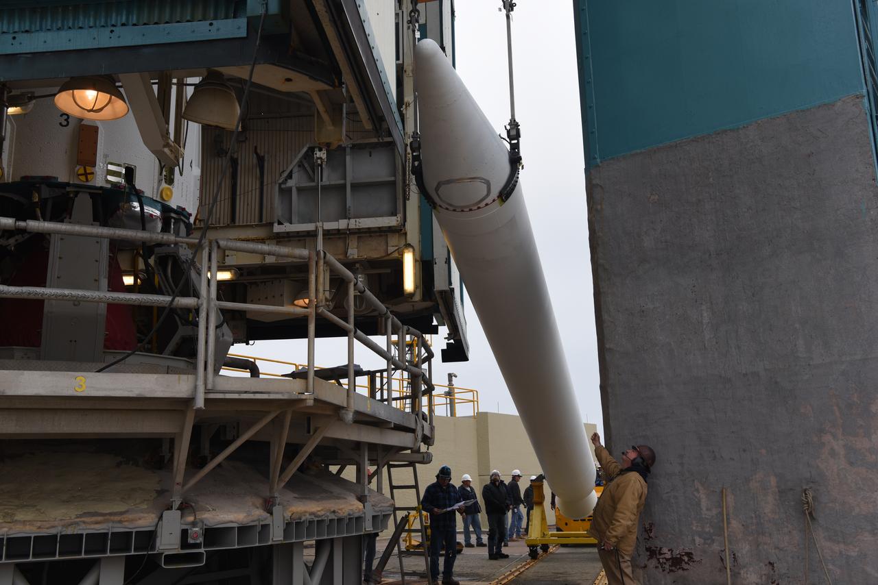 The solid rocket motor for mating to the United Launch Alliance Delta II launch vehicle is lifted up at the Vertical Integration Facility (VIF) at Space Launch Complex 2 on June 14, 2018, at Vandenberg Air Force Base in California. The solid rocket motor will be attached to the rocket. NASA's Ice, Cloud and land Elevation Satellite-2 (ICESat-2) will launch on the final Delta II rocket. ICESat-2 will measure the height of a changing Earth, one laser pulse at a time, 10,000 laser pulses a second. The satellite will carry a single instrument, the Advanced Topographic Laser Altimeter System. ICESat-2 will help scientists investigate why, and how much our planet's frozen and icy areas, called the cryosphere, is changing in a warming climate.
