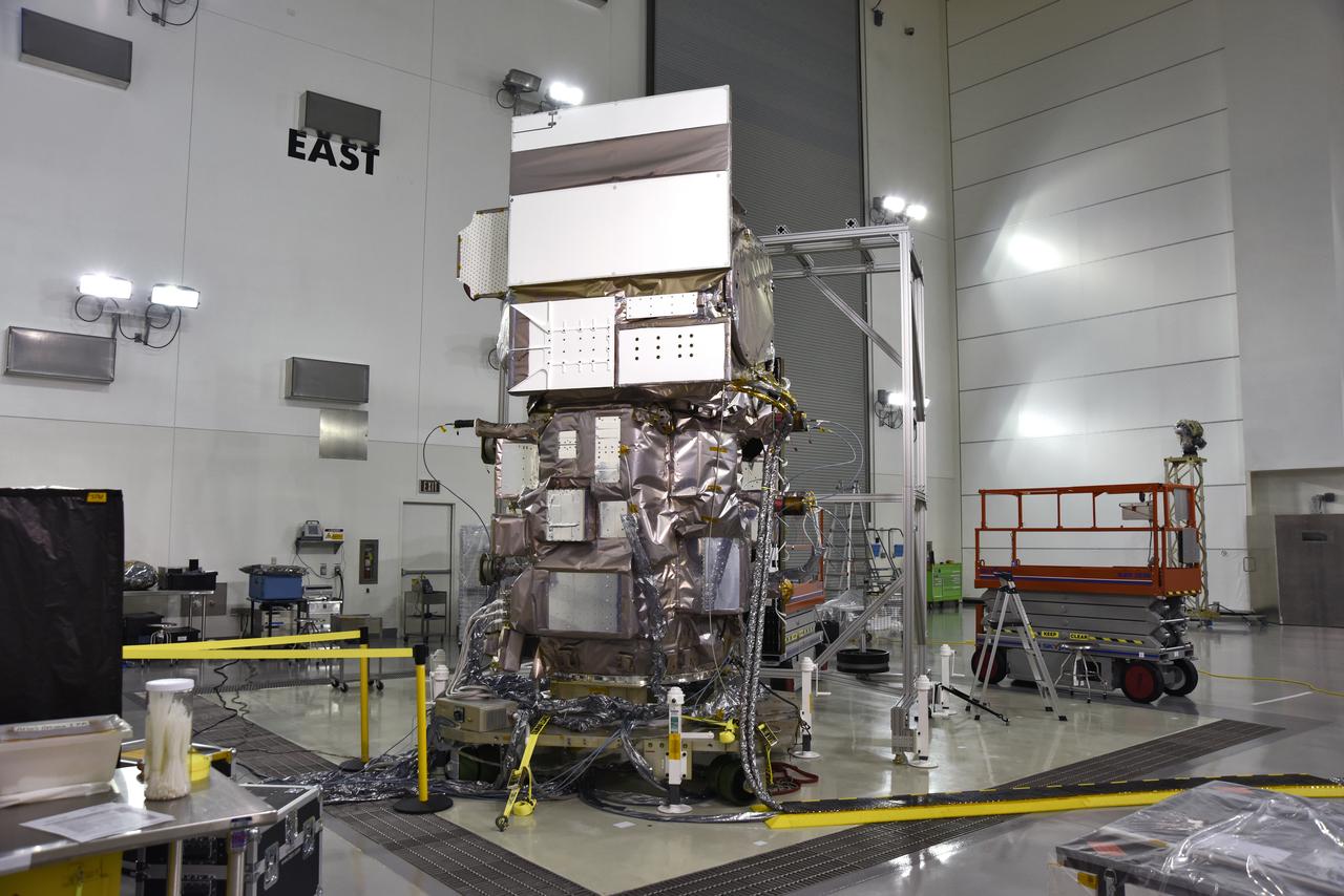 Inside the high bay of the Astrotech Space Operations facility at Vandenberg Air Force Base in California, a solar array first motion test is in progress on NASA's Ice, Cloud and land Elevation Satellite-2 (ICESat-2) on June 18, 2018. The satellite is being prepared for its scheduled launch from Space Launch Complex-2 at Vandenberg on the final United Launch Alliance Delta II rocket. ICESat-2 will measure the height of a changing Earth, one laser pulse at a time, 10,000 laser pulses a second. The satellite will carry the Advanced Topographic Laser Altimeter System. ICESat-2 will help scientists investigate why, and how much our planet's frozen and icy areas, called the cryosphere, is changing in a warming climate.