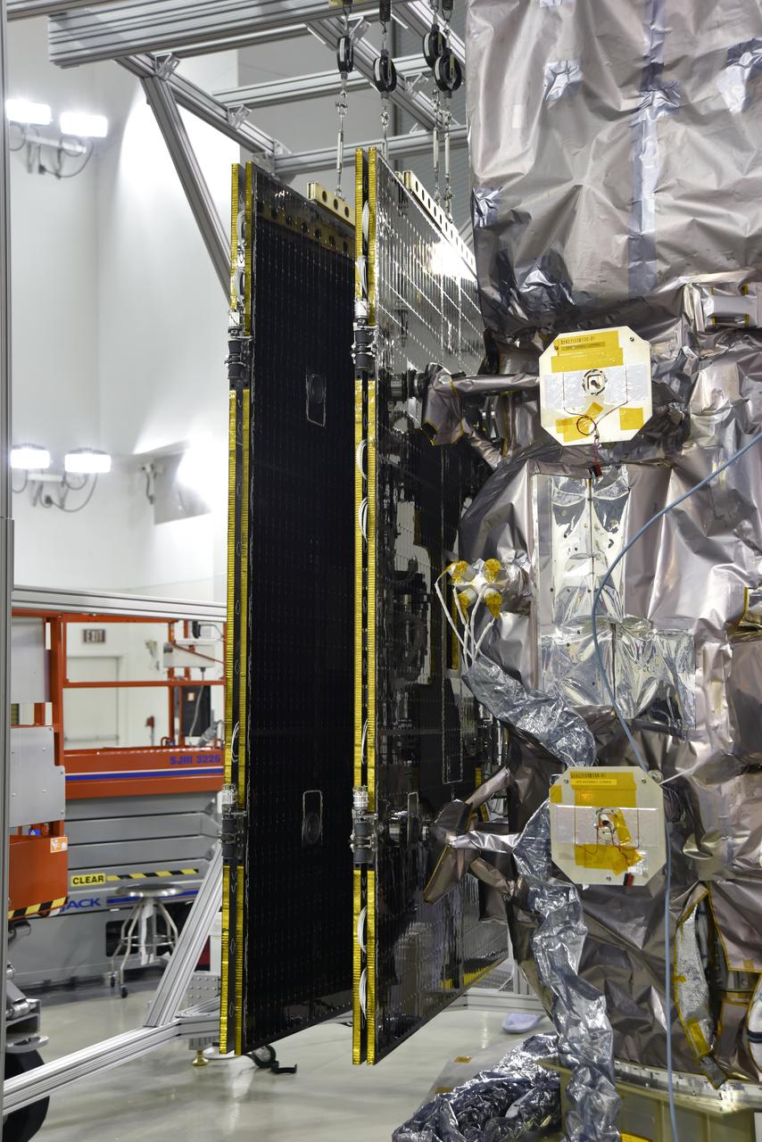 Inside the high bay of the Astrotech Space Operations facility at Vandenberg Air Force Base in California, a solar array first motion test is underway on NASA's Ice, Cloud and land Elevation Satellite-2 (ICESat-2) on June 18, 2018. The satellite is being prepared for its scheduled launch from Space Launch Complex-2 at Vandenberg on the final United Launch Alliance Delta II rocket. ICESat-2 will measure the height of a changing Earth, one laser pulse at a time, 10,000 laser pulses a second. The satellite will carry the Advanced Topographic Laser Altimeter System. ICESat-2 will help scientists investigate why, and how much our planet's frozen and icy areas, called the cryosphere, is changing in a warming climate.