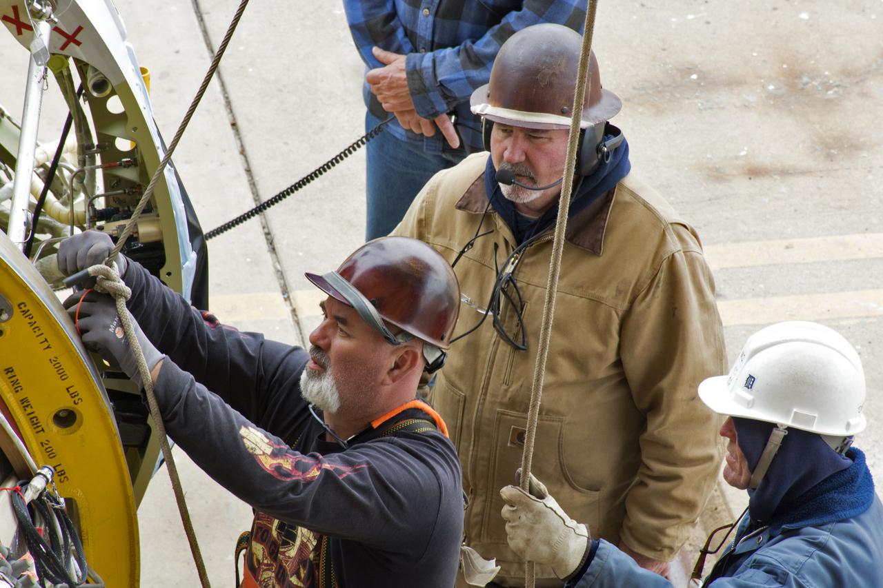 United Launch Alliance workers prepare the first stage of the Delta II second stage to be lifted up in the Vertical Processing Facility at Space Launch Complex 2 on June 21, 2018, at Vandenberg Air Force Base in California. The second stage will be attached to the top of the booster, or first stage, of the rocket.  NASA's Ice, Cloud and land Elevation Satellite-2 (ICESat-2) will launch on the final Delta II rocket. ICESat-2 will measure the height of a changing Earth, one laser pulse at a time, 10,000 laser pulses a second. The satellite will carry a single instrument, the Advanced Topographic Laser Altimeter System. ICESat-2 will help scientists investigate why, and how much our planet's frozen and icy areas, called the cryosphere, is changing in a warming climate.