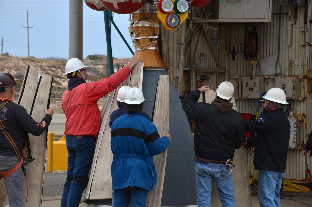 United Launch Alliance workers prepare the first stage of the Delta II second stage to be lifted up in the Vertical Processing Facility at Space Launch Complex 2 on June 21, 2018, at Vandenberg Air Force Base in California. The second stage will be attached to the top of the booster, or first stage, of the rocket.  NASA's Ice, Cloud and land Elevation Satellite-2 (ICESat-2) will launch on the final Delta II rocket. ICESat-2 will measure the height of a changing Earth, one laser pulse at a time, 10,000 laser pulses a second. The satellite will carry a single instrument, the Advanced Topographic Laser Altimeter System. ICESat-2 will help scientists investigate why, and how much our planet's frozen and icy areas, called the cryosphere, is changing in a warming climate.
