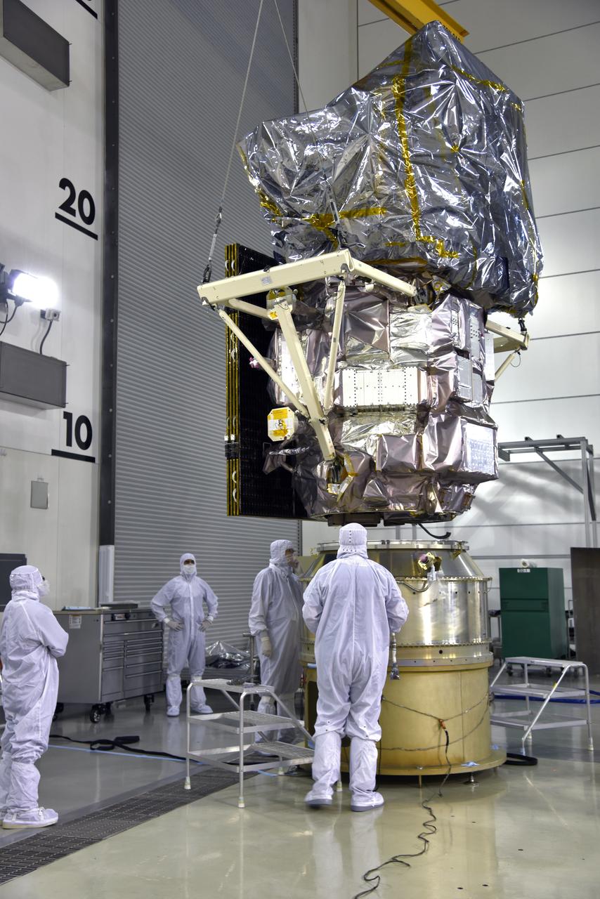 Inside the high bay of the Astrotech Space Operations facility at Vandenberg Air Force Base in California, a crane lifts and moves NASA's Ice, Cloud and land Elevation Satellite-2 (ICESat-2) over the payload adapter on Aug. 30, 2018. The satellite will be attached to the adapter. ICESat-2 is being prepared for its scheduled launch from Space Launch Complex 2 at Vandenberg on the final United Launch Alliance Delta II rocket. ICESat-2 will measure the height of a changing Earth, one laser pulse at a time, 10,000 laser pulses a second. The satellite will carry the Advanced Topographic Laser Altimeter System (ATLAS). ICESat-2 will help scientists investigate why, and how much our planet's frozen and icy areas, called the cryosphere, are changing in a warming climate.