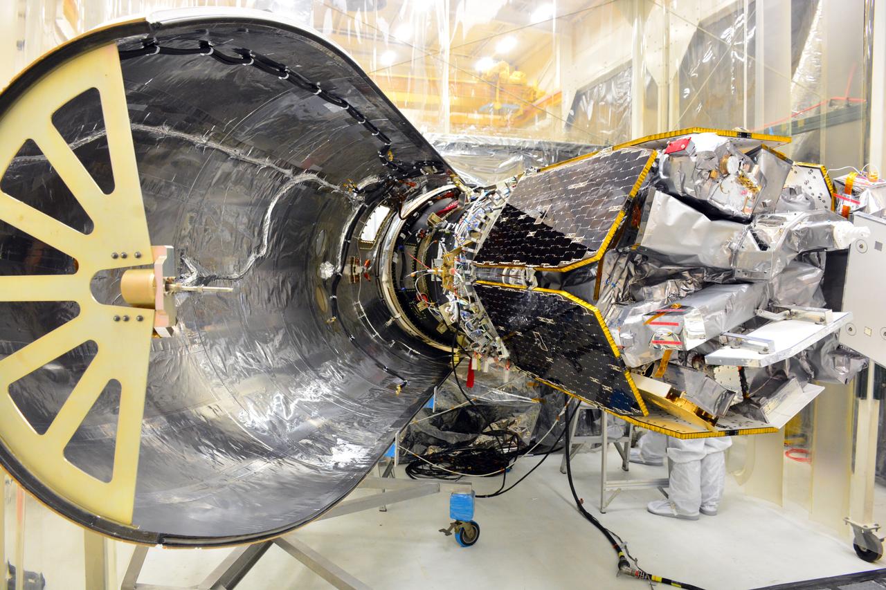 NASA's Ionospheric Connection Explorer (ICON) is attached to the Northrop Grumman Pegasus XL rocket inside Building 1555 at Vandenberg Air Force Base in California. Preparations are underway to perform a black light test on Pegasus before the port and starboard payload fairings are installed around ICON on Aug. 22, 2018. The Pegasus XL rocket, attached beneath the company's L-1011 Stargazer aircraft, will launch ICON from the Skid Strip at Cape Canaveral Air Force Station in Florida. Launch is scheduled for Oct. 26. ICON will study the frontier of space - the dynamic zone high in Earth's atmosphere where terrestrial weather from below meets space weather above. The explorer will help determine the physics of Earth's space environment and pave the way for mitigating its effects on our technology and communications systems.