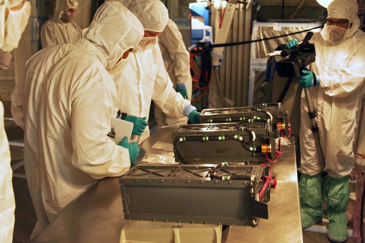 At Space Launch Complex 2 at Vandenberg Air Force Base in California, technicians prepare three poly picosatellite orbital deployers, or P-POD containers, with tiny satellites, called CubeSats inside, for installation on the direct mate adapter of the United Launch Alliance Delta II rocket, on Aug. 31, 2018. NASA's Ice, Cloud and land Elevation Satellite-2 (ICESat-2) is ready for launch aboard the final Delta II rocket. Launch is scheduled for Sept. 15, 2018. ICESat-2 will measure the height of a changing Earth, one laser pulse at a time, 10,000 laser pulses a second. The satellite will carry the Advanced Topographic Laser Altimeter System (ATLAS). ICESat-2 will help scientists investigate why, and how much our planet's frozen and icy areas, called the cryosphere, are changing in a warming climate.