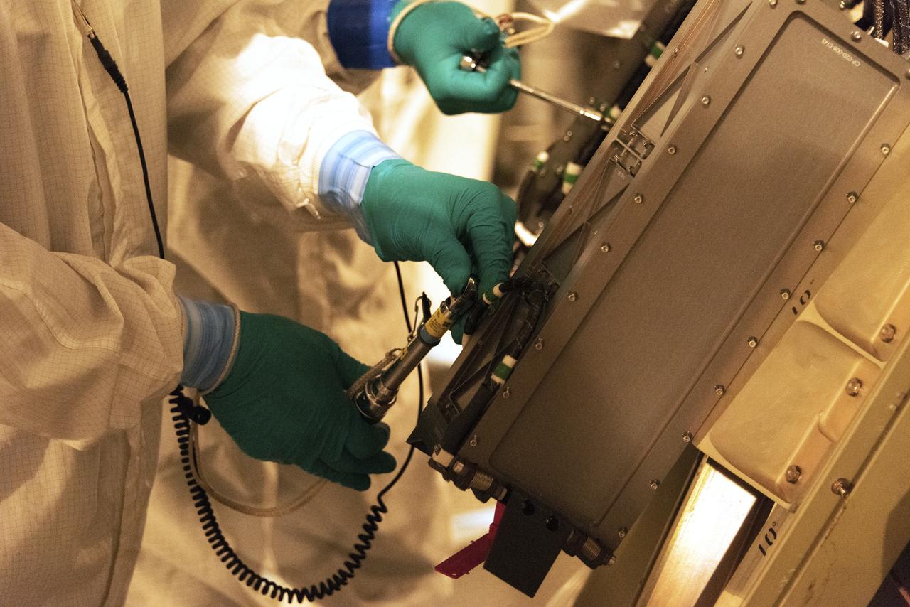 At Space Launch Complex 2 at Vandenberg Air Force Base in California, technicians install a poly picosatellite orbital deployer, or P-POD container, with tiny satellites called CubeSats inside, onto the direct mate adapter of the United Launch Alliance Delta II rocket, on Aug. 31, 2018. NASA's Ice, Cloud and land Elevation Satellite-2 (ICESat-2) is ready for launch aboard the final Delta II rocket. Launch is scheduled for Sept. 15, 2018. ICESat-2 will measure the height of a changing Earth, one laser pulse at a time, 10,000 laser pulses a second. The satellite will carry the Advanced Topographic Laser Altimeter System (ATLAS). ICESat-2 will help scientists investigate why, and how much our planet's frozen and icy areas, called the cryosphere, are changing in a warming climate.