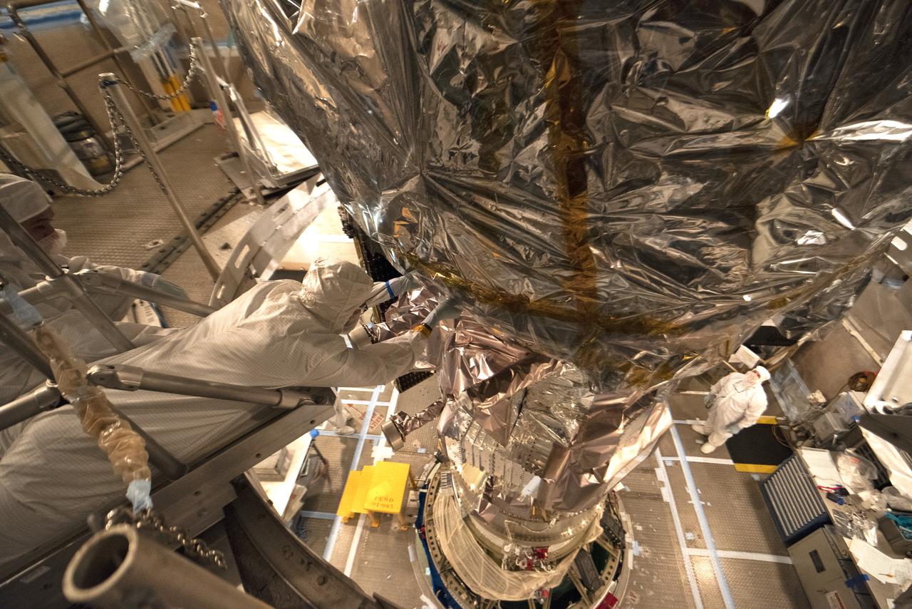 Technicians prepare NASA's Ice, Cloud and land Elevation Satellite-2 (ICESat-2) for encapsulation in the United Launch Alliance Delta II payload fairing on Sept. 4, 2018, at Space Launch Complex 2 at Vandenberg Air Force Base in California. The satellite is being prepared for its scheduled launch on the final Delta II rocket. ICESat-2 will measure the height of a changing Earth, one laser pulse at a time, 10,000 laser pulses a second. The satellite will carry the Advanced Topographic Laser Altimeter System (ATLAS). ICESat-2 will help scientists investigate why, and how much our planet's frozen and icy areas, called the cryosphere, are changing in a warming climate.