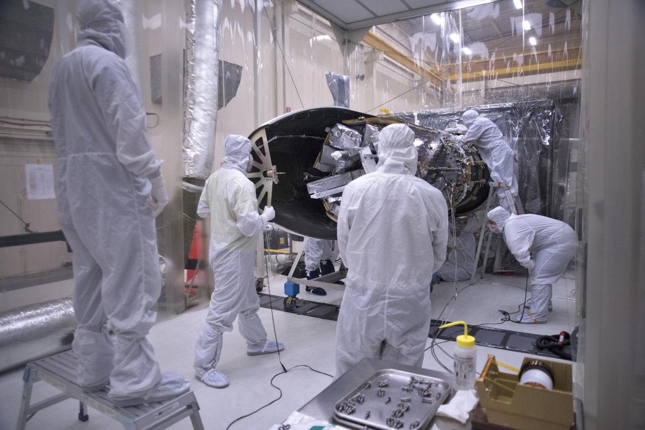 Inside a clean room in Building 1555 at Vandenberg Air Force Base in California, technicians install the first half of the Northrop Grumman Pegasus XL payload fairing around NASA's Ionospheric Connection Explorer (ICON) on Oct. 4, 2018. ICON is being prepared for its launch on the Pegasus XL, which is attached to the company's L-1011 Stargazer aircraft, from the Skid Strip at Cape Canaveral Air Force Station in Florida. Launch is scheduled for Oct. 26. ICON will study the frontier of space - the dynamic zone high in Earth's atmosphere where terrestrial weather from below meets space weather above. The explorer will help determine the physics of Earth's space environment and pave the way for mitigating its effects on our technology, communications systems and society.