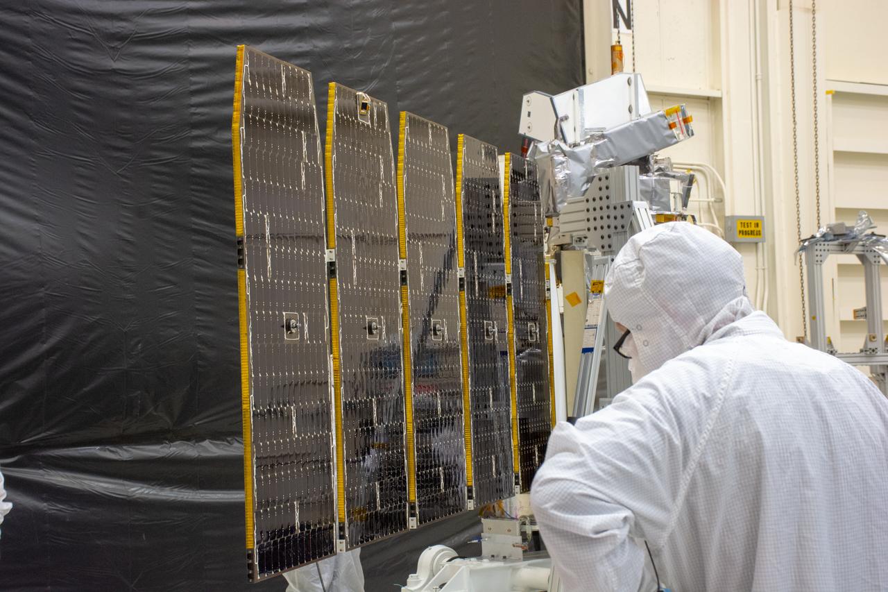 Technicians extend the solar array on NASA's Ionospheric Connection Explorer (ICON) during a deployment test inside Building 1555 at Vandenberg Air Force Base in California on Aug. 10, 2019. ICON will launch on a Pegasus XL rocket, attached beneath the company's L-1011 Stargazer aircraft, from the Skid Strip at Cape Canaveral Air Force Station in Florida. Launch is scheduled for Oct. 10. ICON will study the frontier of space - the dynamic zone high in Earth's atmosphere where terrestrial weather from below meets space weather above. The explorer will help determine the physics of Earth's space environment and pave the way for mitigating its effects on our technology and communications systems.
