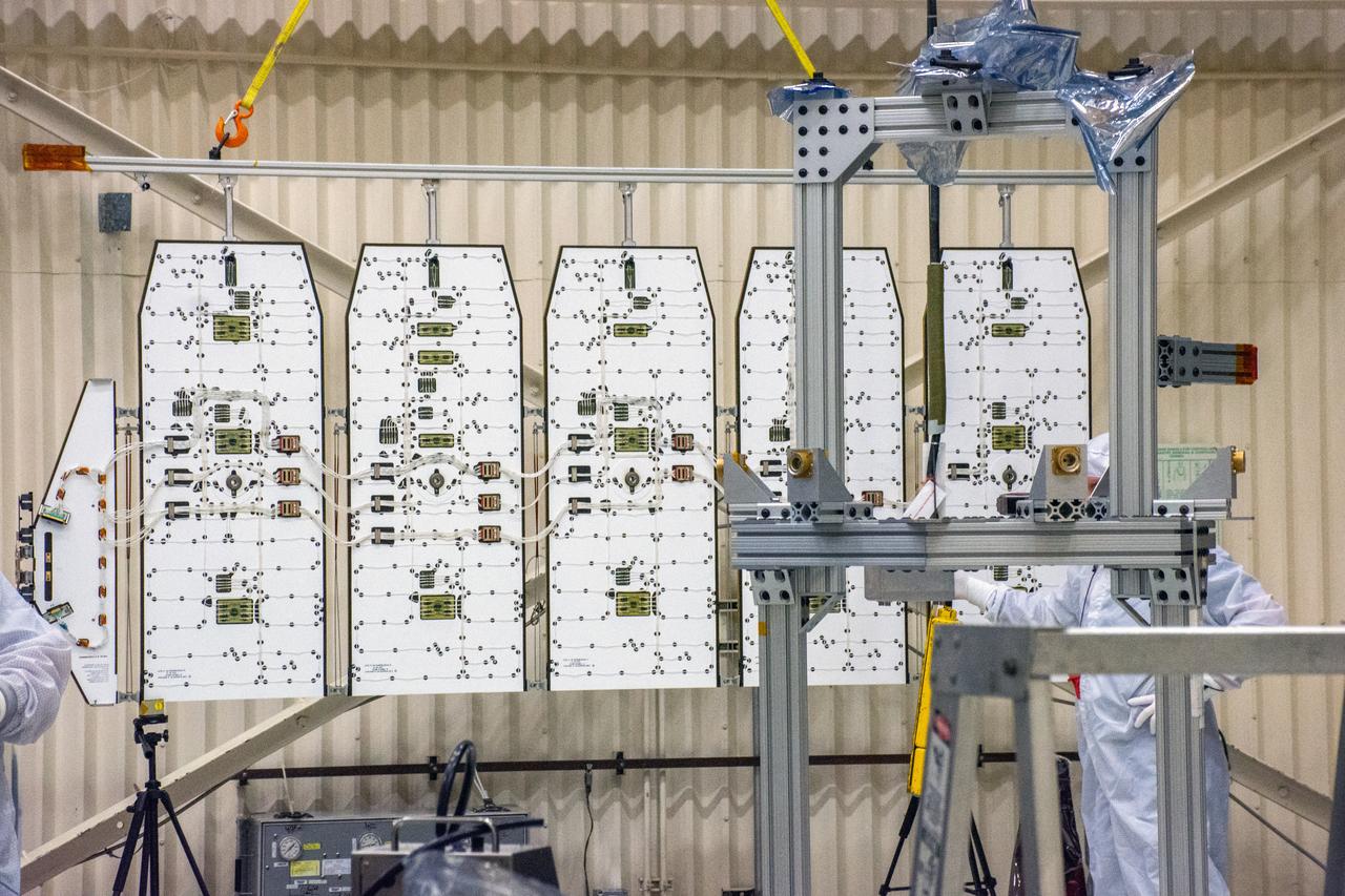 Technicians removed the solar array from NASA's Ionospheric Connection Explorer (ICON) during a deployment test inside Building 1555 at Vandenberg Air Force Base in California on Aug. 10, 2019. ICON is being prepared for its launch on a Pegasus XL rocket, attached beneath the company's L-1011 Stargazer aircraft. Launch is scheduled for Oct. 10, 2019, from the Skid Strip at Cape Canaveral Air Force Station in Florida. ICON will study the frontier of space - the dynamic zone high in Earth's atmosphere where terrestrial weather from below meets space weather above. The explorer will help determine the physics of Earth's space environment and pave the way for mitigating its effects on our technology and communications systems.