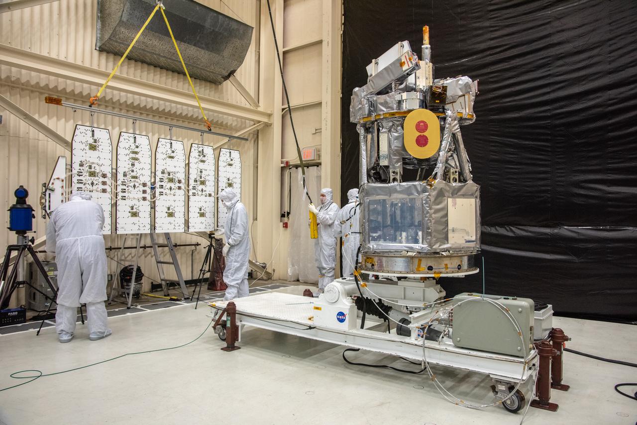 Technicians prepare to install the solar array for NASA's Ionospheric Connection Explorer (ICON) inside Building 1555 at Vandenberg Air Force Base in California on Aug. 28, 2019. ICON launched on a Northrop Grumman Pegasus XL rocket, attached beneath the company's L-1011 Stargazer aircraft, on Oct. 10, 2019, after takeoff from the Skid Strip at Cape Canaveral Air Force Station in Florida. ICON will study the frontier of space - the dynamic zone high in Earth's atmosphere where terrestrial weather from below meets space weather above. The explorer will help determine the physics of Earth's space environment and pave the way for mitigating its effects on our technology, communications systems and society.