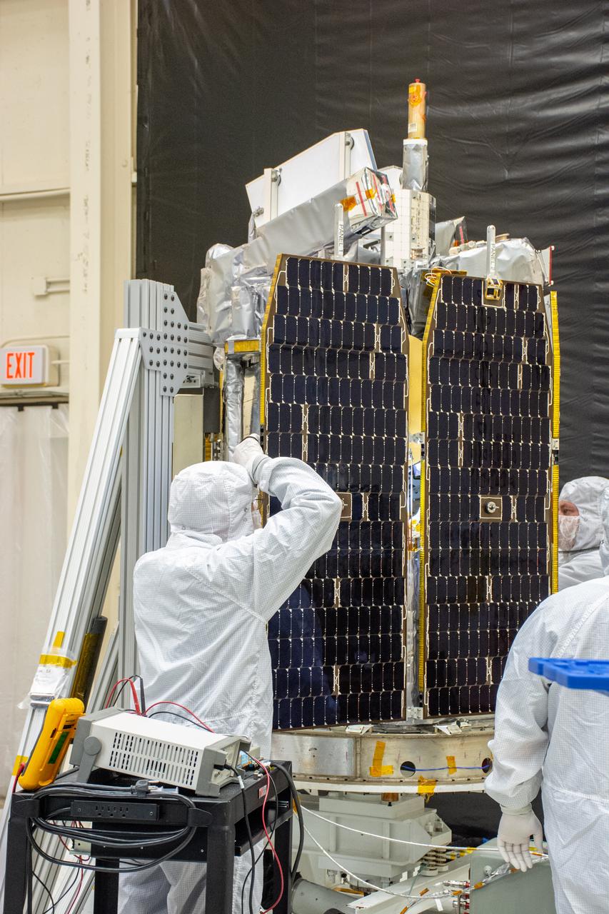 Technicians install the solar array for NASA's Ionospheric Connection Explorer (ICON) inside Building 1555 at Vandenberg Air Force Base in California on Aug. 28, 2019. ICON launched on a Northrop Grumman Pegasus XL rocket, attached beneath the company's L-1011 Stargazer aircraft, on Oct. 10, 2019, after takeoff from the Skid Strip at Cape Canaveral Air Force Station in Florida. ICON will study the frontier of space - the dynamic zone high in Earth's atmosphere where terrestrial weather from below meets space weather above. The explorer will help determine the physics of Earth's space environment and pave the way for mitigating its effects on our technology, communications systems and society.