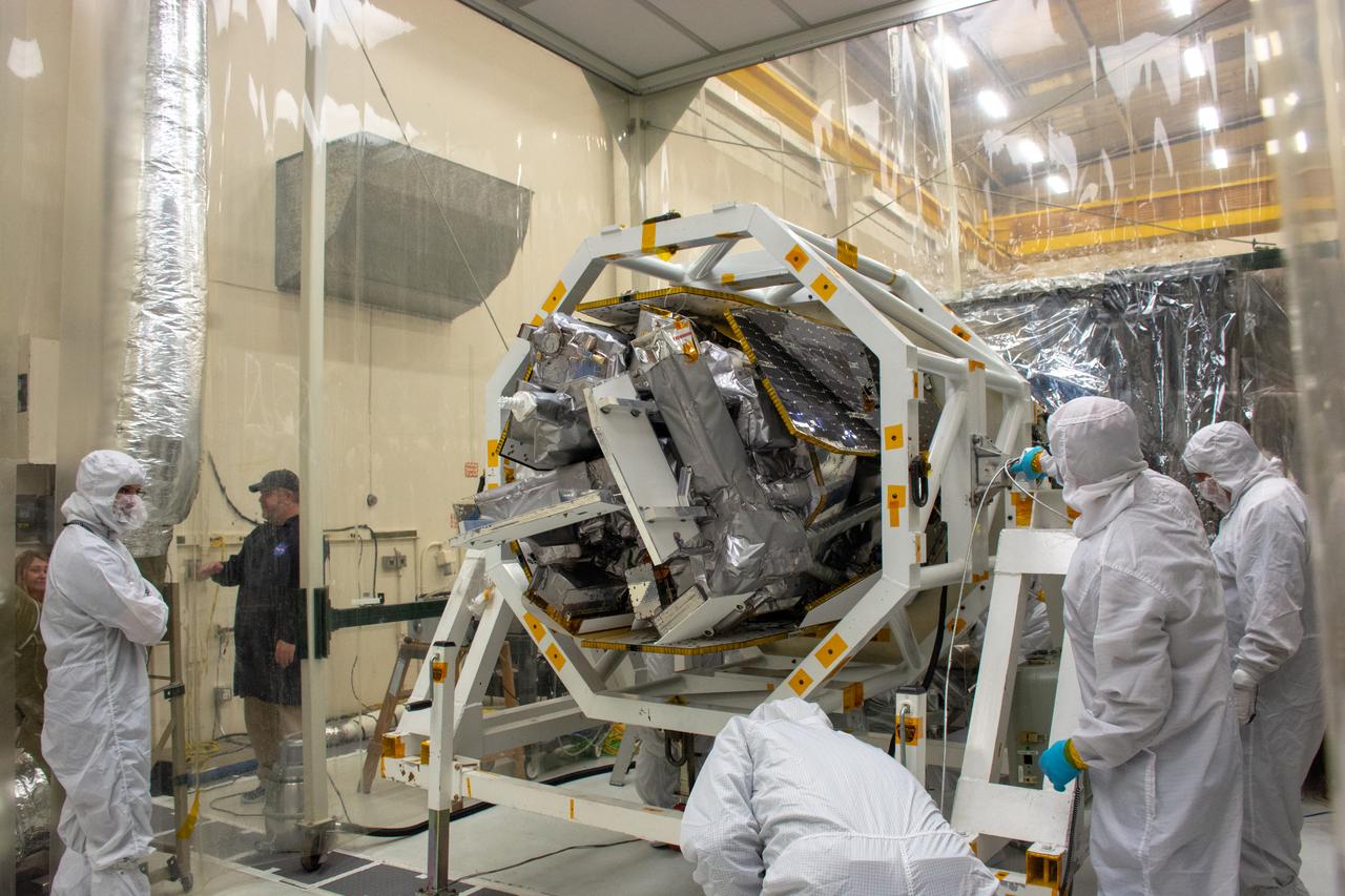 Technicians attach NASA's Ionospheric Connection Explorer (ICON) to the Northrop Grumman Pegasus XL rocket inside Building 1555 at Vandenberg Air Force Base in California on Sept. 10, 2019. Preparations are underway to perform a black light test on Pegasus before the port and starboard payload fairings are installed around ICON. The Pegasus XL rocket, attached beneath the company's L-1011 Stargazer aircraft, will launch ICON from the Skid Strip at Cape Canaveral Air Force Station in Florida. Launch is scheduled for Oct. 9, 2019. ICON will study the frontier of space - the dynamic zone high in Earth's atmosphere where terrestrial weather from below meets space weather above. The explorer will help determine the physics of Earth's space environment and pave the way for mitigating its effects on our technology and communications systems.