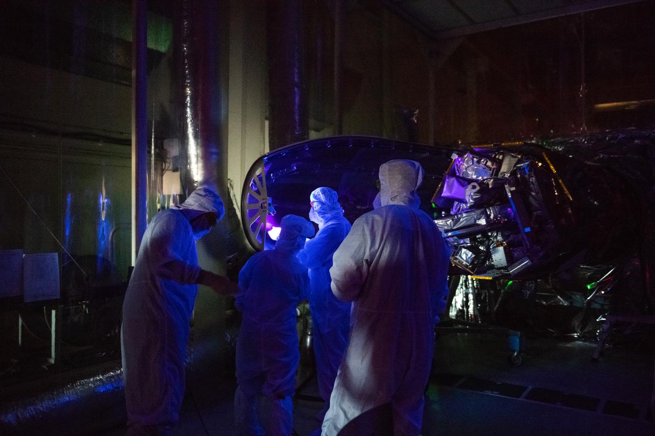 Technicians install the starboard side of the Northrop Grumman Pegasus XL rocket’s payload fairing around NASA's Ionospheric Connection Explorer (ICON) inside Building 1555 at Vandenberg Air Force Base in California on Sept. 17, 2019. ICON launched on the Pegasus XL rocket, attached beneath the company's L-1011 Stargazer aircraft, on Oct. 10, 2019, after takeoff from the Skid Strip at Cape Canaveral Air Force Station in Florida. ICON will study the frontier of space - the dynamic zone high in Earth's atmosphere where terrestrial weather from below meets space weather above. The explorer will help determine the physics of Earth's space environment and pave the way for mitigating its effects on our technology, communications systems and society.