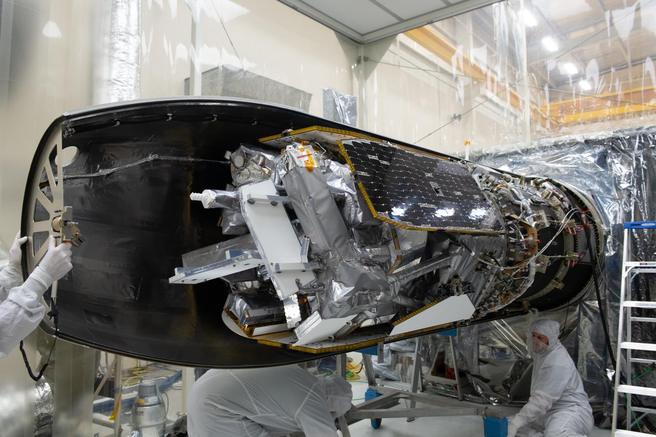 The starboard side of the Northrop Grumman Pegasus XL rocket’s payload fairing has been installed around NASA's Ionospheric Connection Explorer (ICON) inside Building 1555 at Vandenberg Air Force Base in California on Sept. 17, 2019. ICON launched on the Pegasus XL rocket, attached beneath the company's L-1011 Stargazer aircraft, on Oct. 10, 2019, after takeoff from the Skid Strip at Cape Canaveral Air Force Station in Florida. ICON will study the frontier of space - the dynamic zone high in Earth's atmosphere where terrestrial weather from below meets space weather above. The explorer will help determine the physics of Earth's space environment and pave the way for mitigating its effects on our technology, communications systems and society.