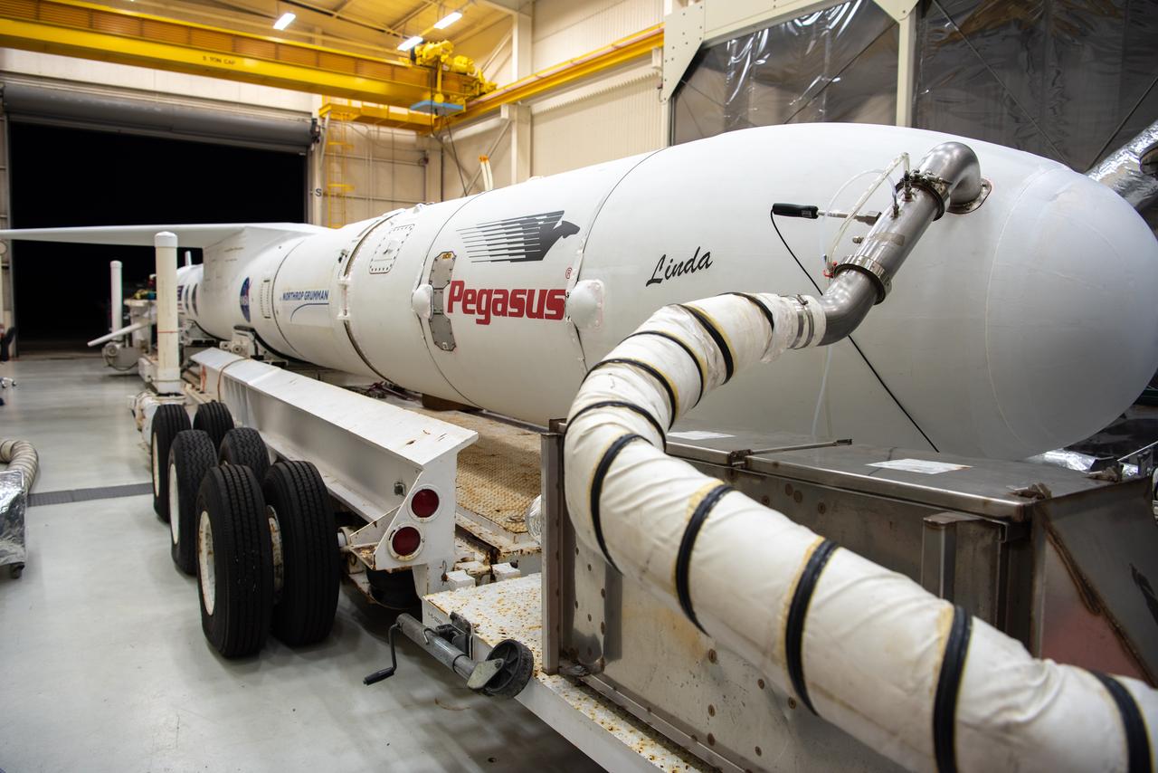 The Northrop Grumman Pegasus XL rocket, with NASA's Ionospheric Connection Explorer (ICON) secured in its payload fairing, begins rollout from Building 1555 at Vandenberg Air Force Base in California on Sept. 25, 2019. The Pegasus XL rocket will be attached beneath the company's L-1011 Stargazer aircraft for the flight to Cape Canaveral Air Force Station (CCAFS) in Florida. ICON will launch from the Skid Strip at CCAFS. Launch is scheduled for Oct. 10, 2019. ICON will study the frontier of space - the dynamic zone high in Earth's atmosphere where terrestrial weather from below meets space weather above. The explorer will help determine the physics of Earth's space environment and pave the way for mitigating its effects on our technology and communications systems.