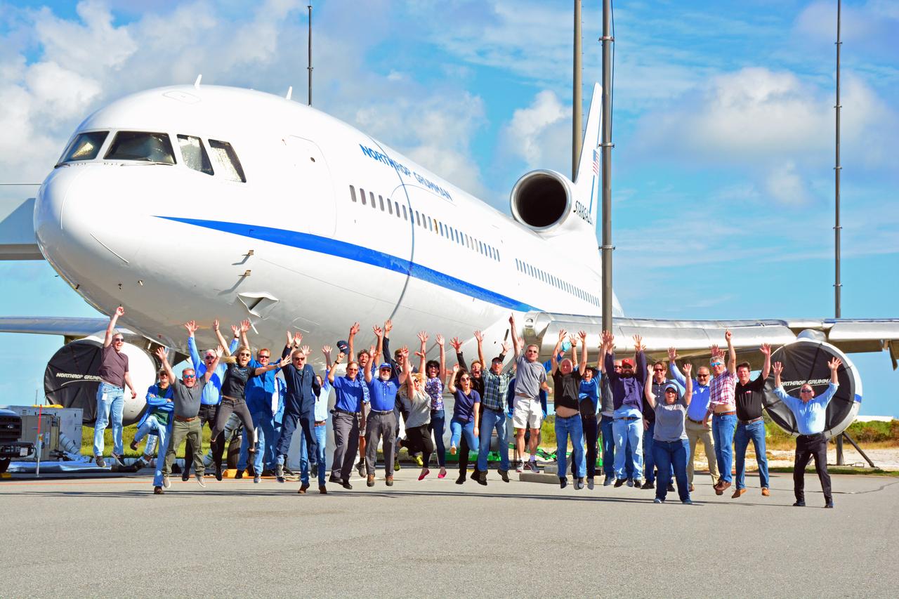 Members of the launch team for NASA’s Ionospheric Connection Explorer (ICON) gather for a joyous group photo in front of the Northrop Grumman L-1011 Stargazer aircraft carrying the Pegasus XL rocket at the Skid Strip at Florida’s Cape Canaveral Air Force Station, Nov. 10, 2019. Hours later, the rocket containing ICON air-launched from beneath the aircraft off the coast of Daytona Beach.  ICON will study the frontier of space - the dynamic zone high in Earth's atmosphere where terrestrial weather from below meets space weather above. The explorer will help determine the physics of Earth's space environment and pave the way for mitigating its effects on our technology, communications systems and society.