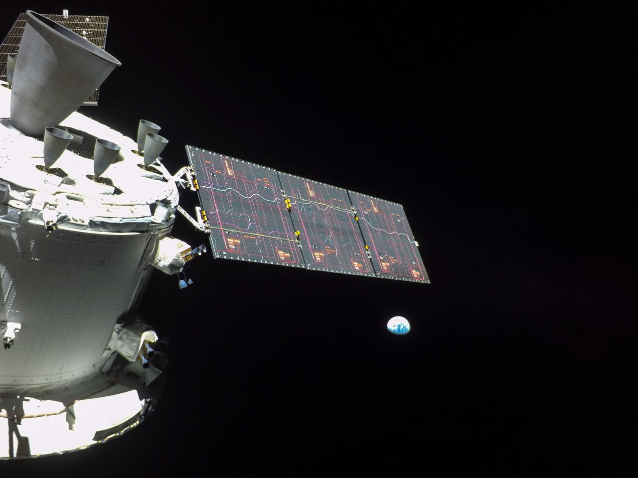 art001e000667 (Nov. 27, 2022) On flight day 12 of the 25.5-day Artemis I mission, a camera on the tip of one of Orion’s solar arrays captured the Earth as Orion travels in distant retrograde orbit around the Moon.