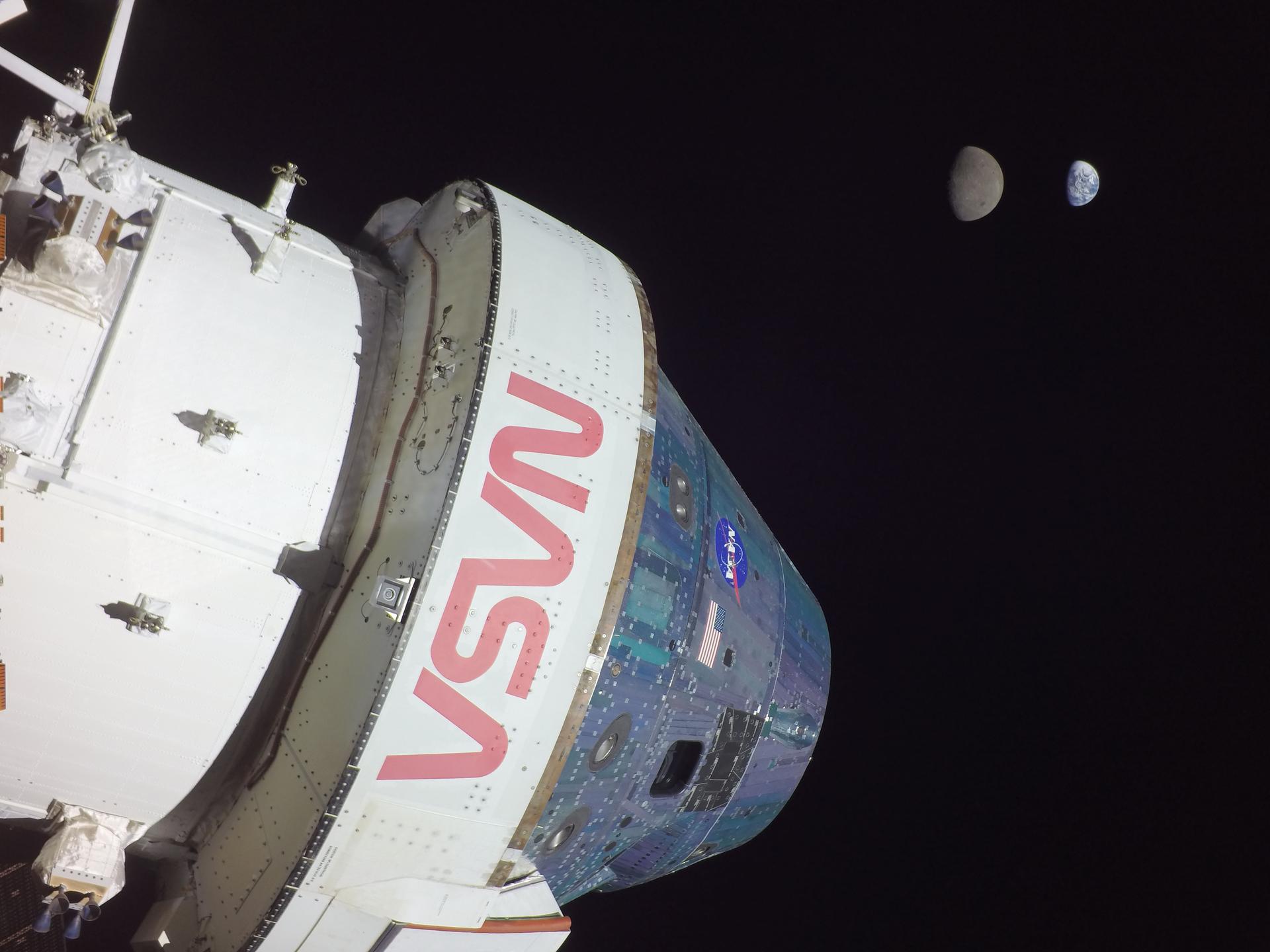 This photograph shows Orion in the foreground on flight day 13 of the Artemis 1 mission, Nov. 28, 2022. Earth and the Moon can be seen in the background. On that day, Orion reached its maximum distance from Earth during the Artemis I mission when it was 268,563 miles away from our home planet. Orion has now traveled farther than any other spacecraft built for humans.
