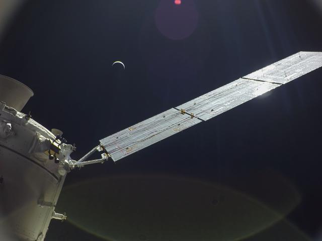 NASA image: Flight Day 22: Orion and Crescent Earth
