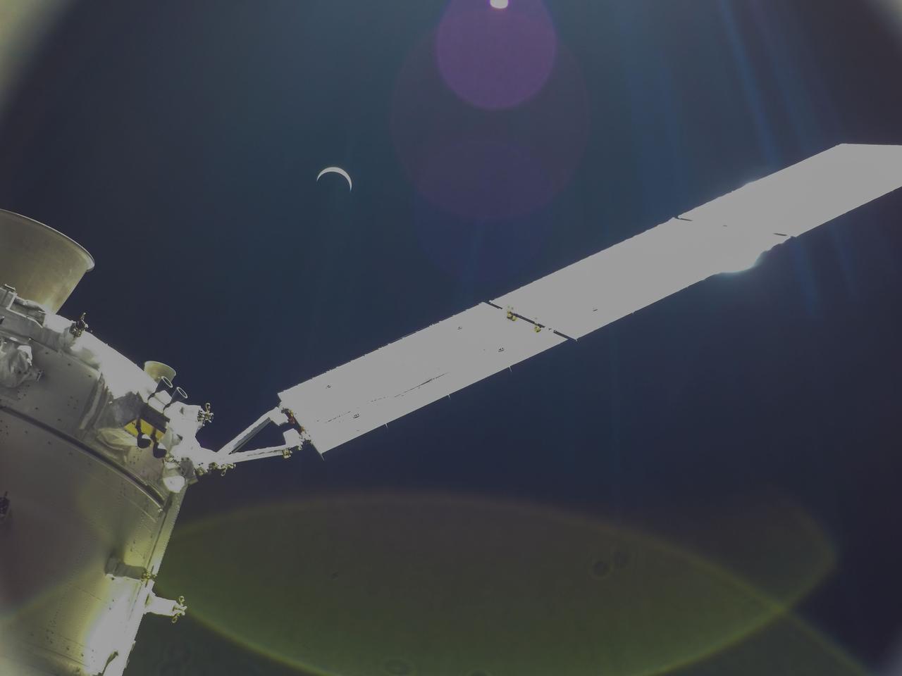 art001e002192 (Dec. 7, 2022) Orion continues its journey home to Earth, which appears here as a crescent, still 234,000 miles away. The Artemis I spacecraft is scheduled to splash down in the Pacific Ocean on Sunday, Dec. 11.