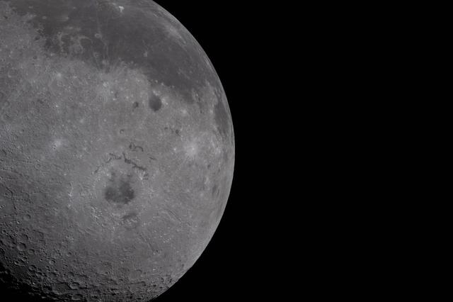 Just over half of the Moon fills the left half of the image....